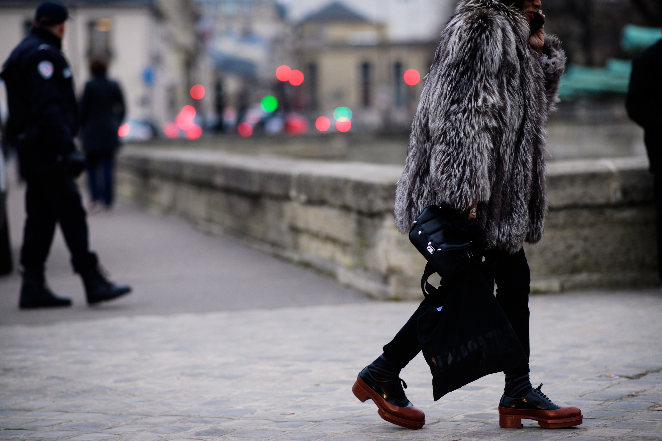 Woman wearing fur coat and Prada shoes