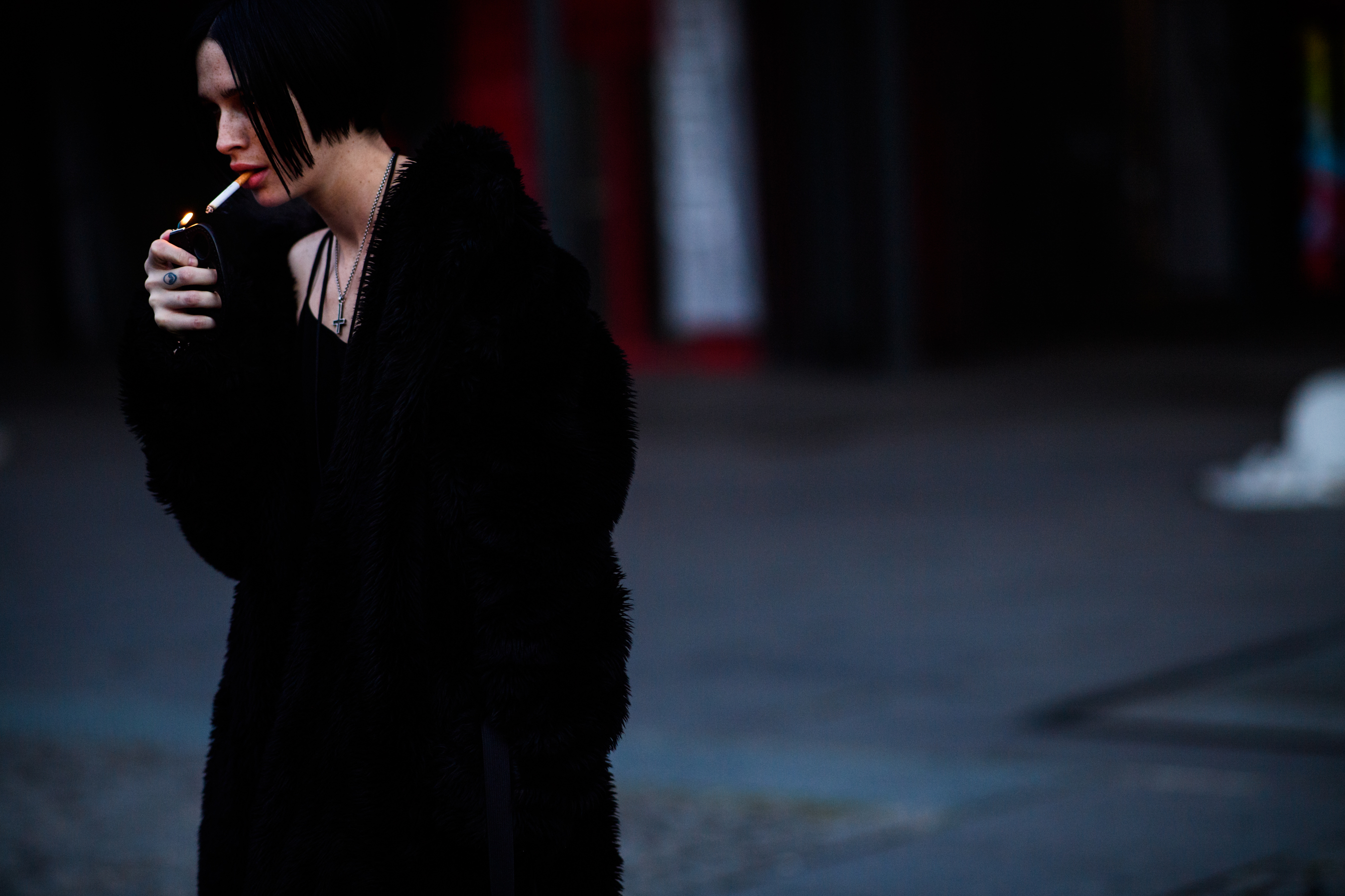 Woman in black with cigarette