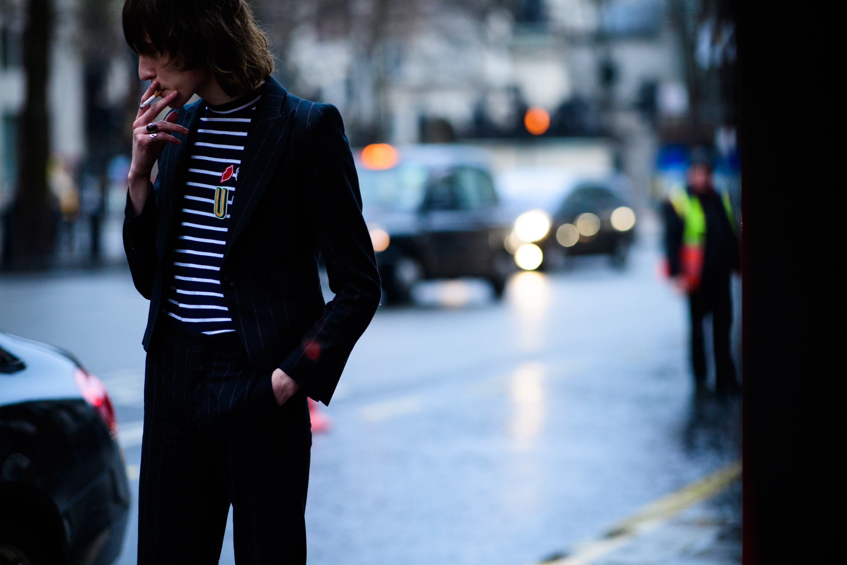 Male model wearing striped sweater