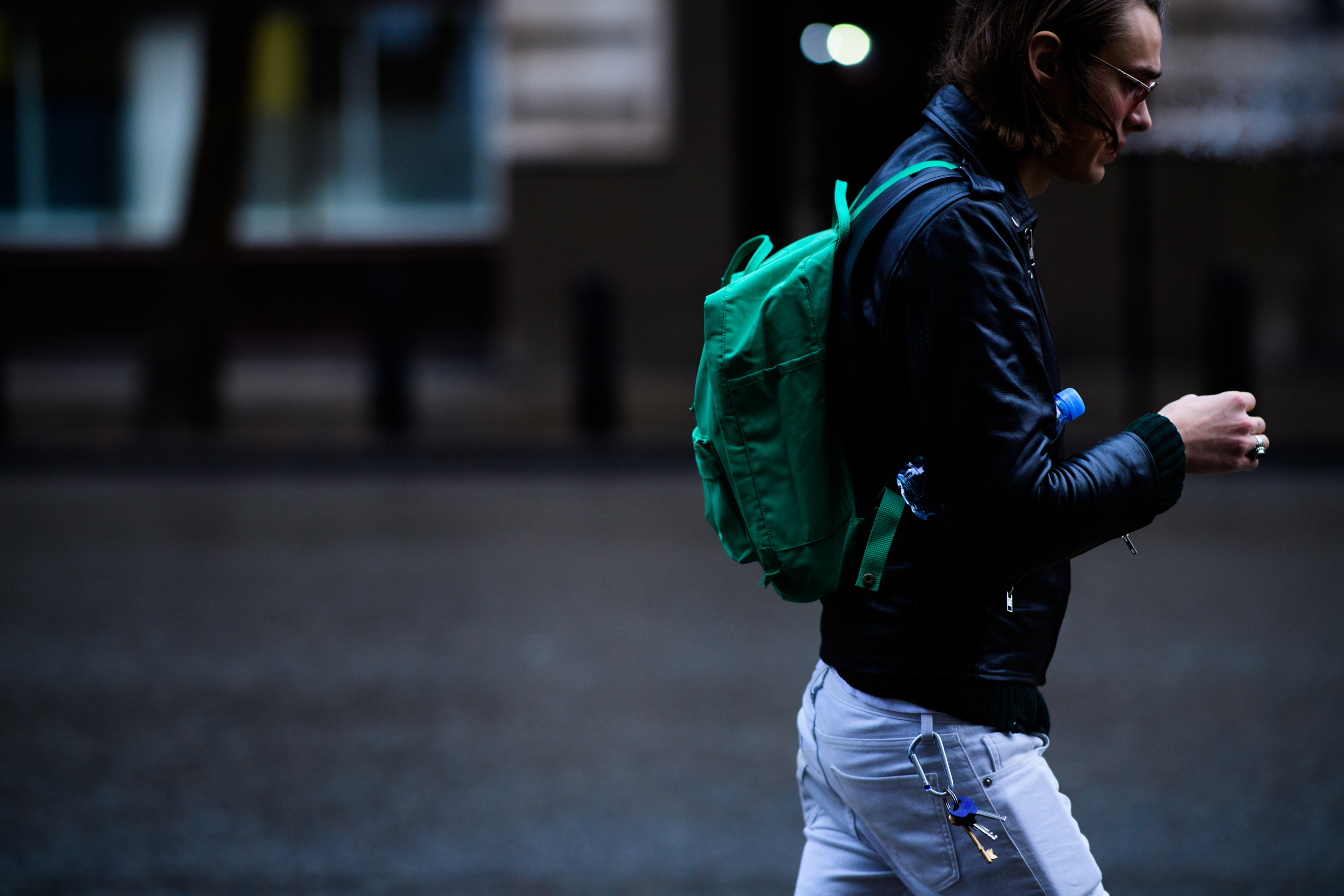 Model with green backpack