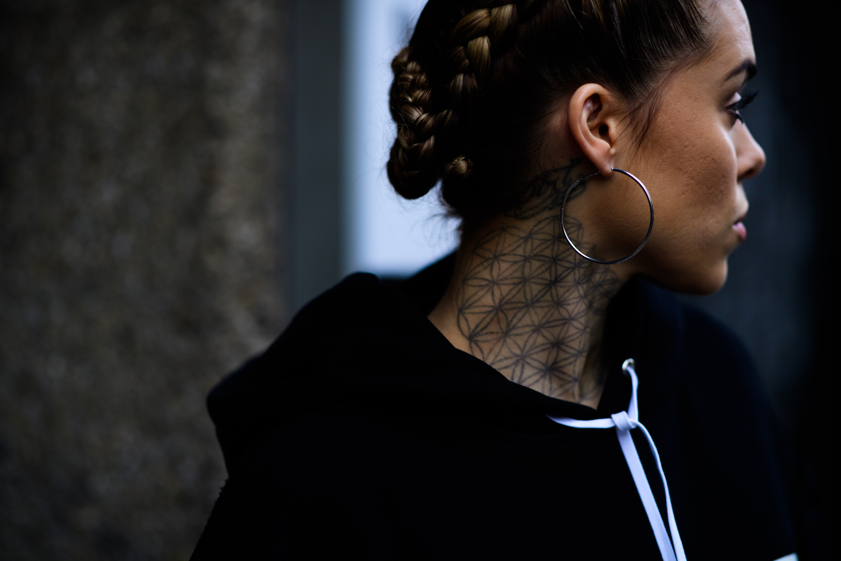 Woman with tattoo on neck