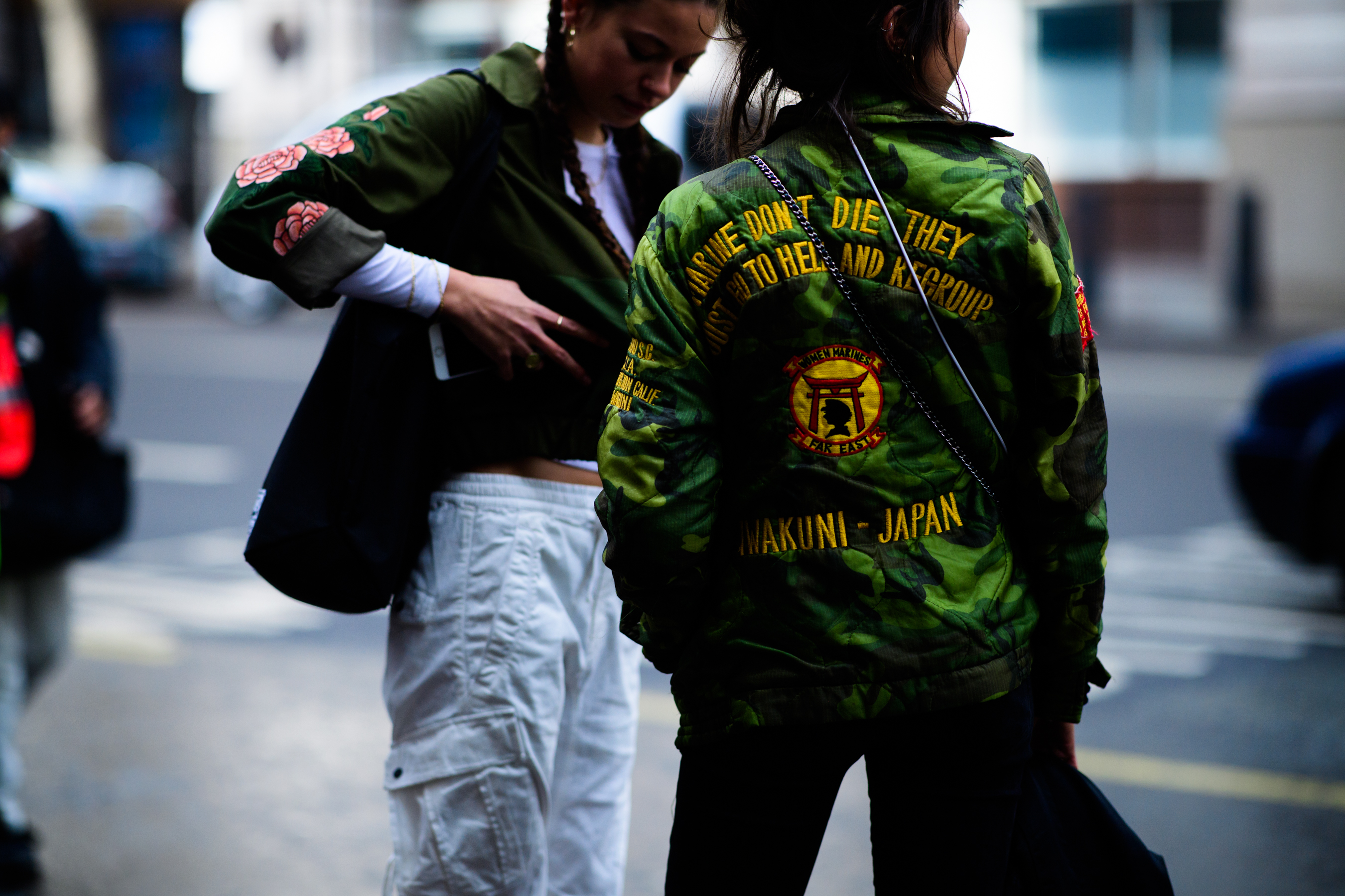 Women wearing green jackets