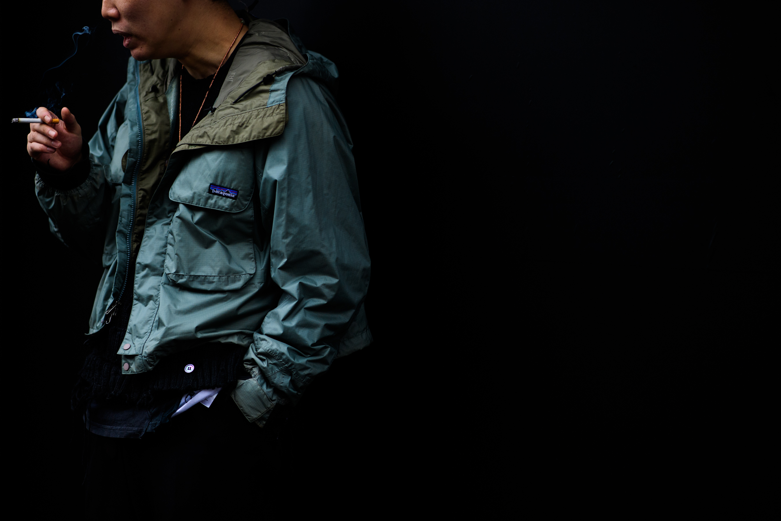 Asian man wearing patagonia jacket