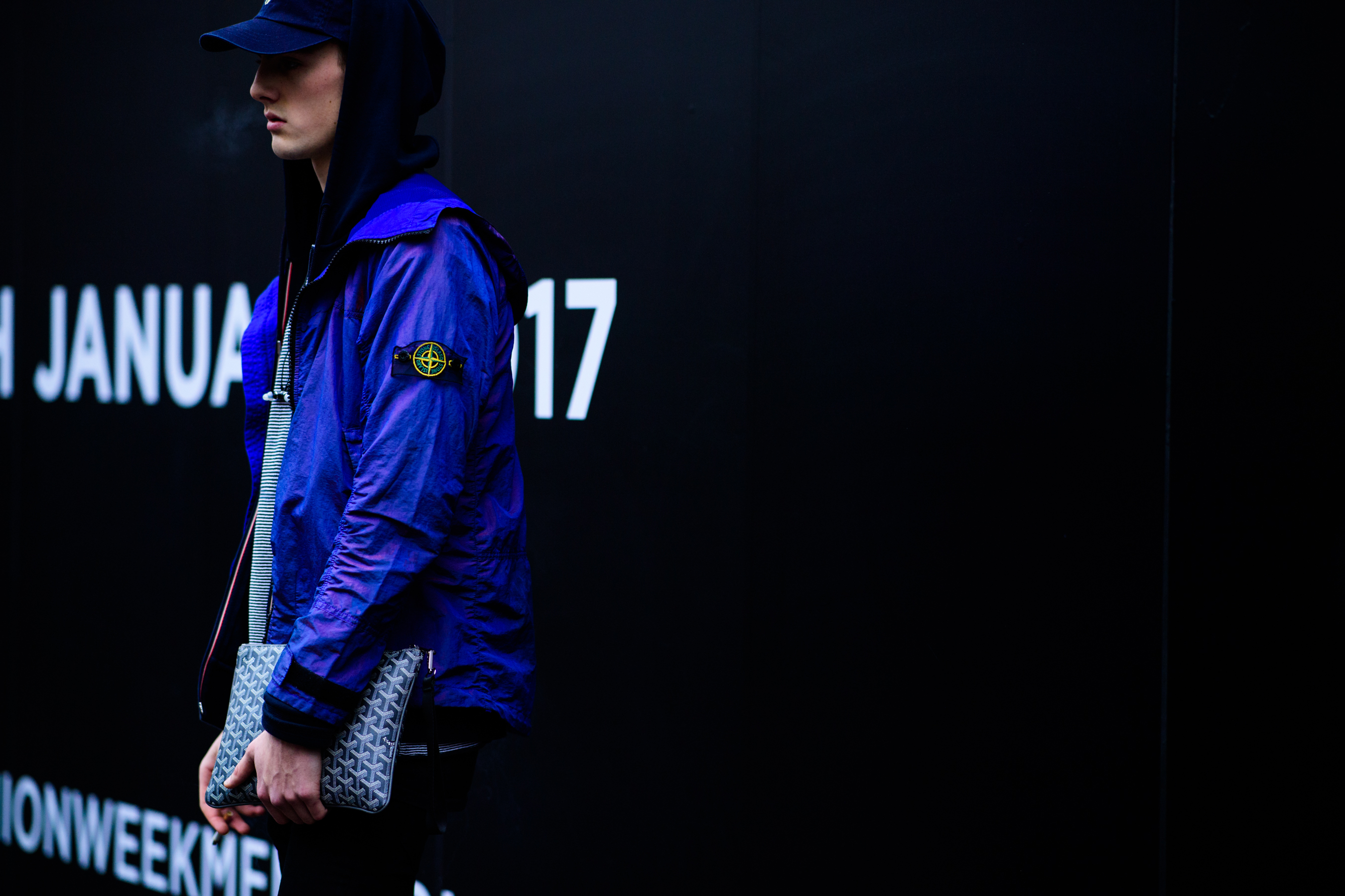 Model wearing blue Stone Island jacket