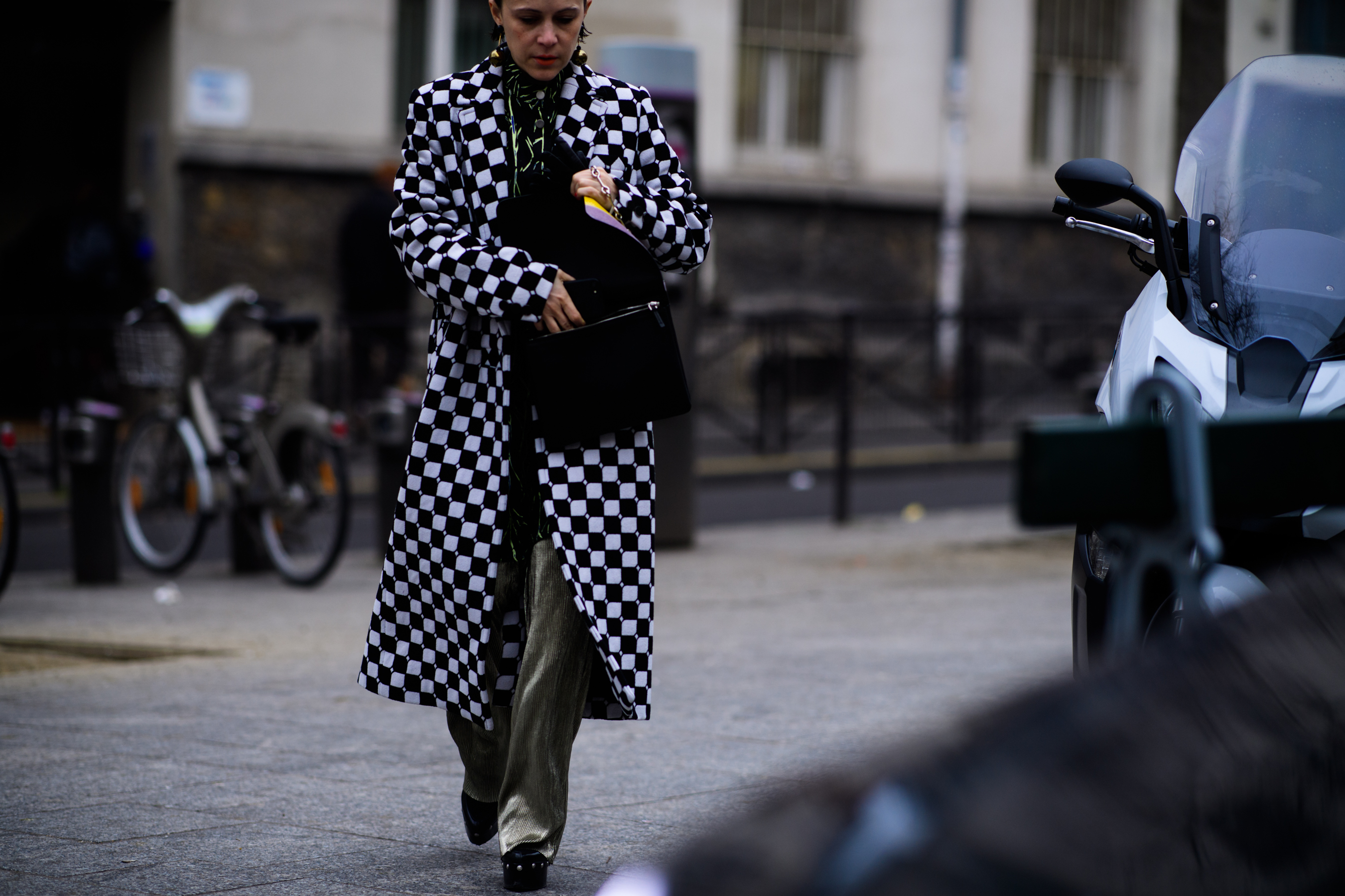 Woman wearing black and white coat