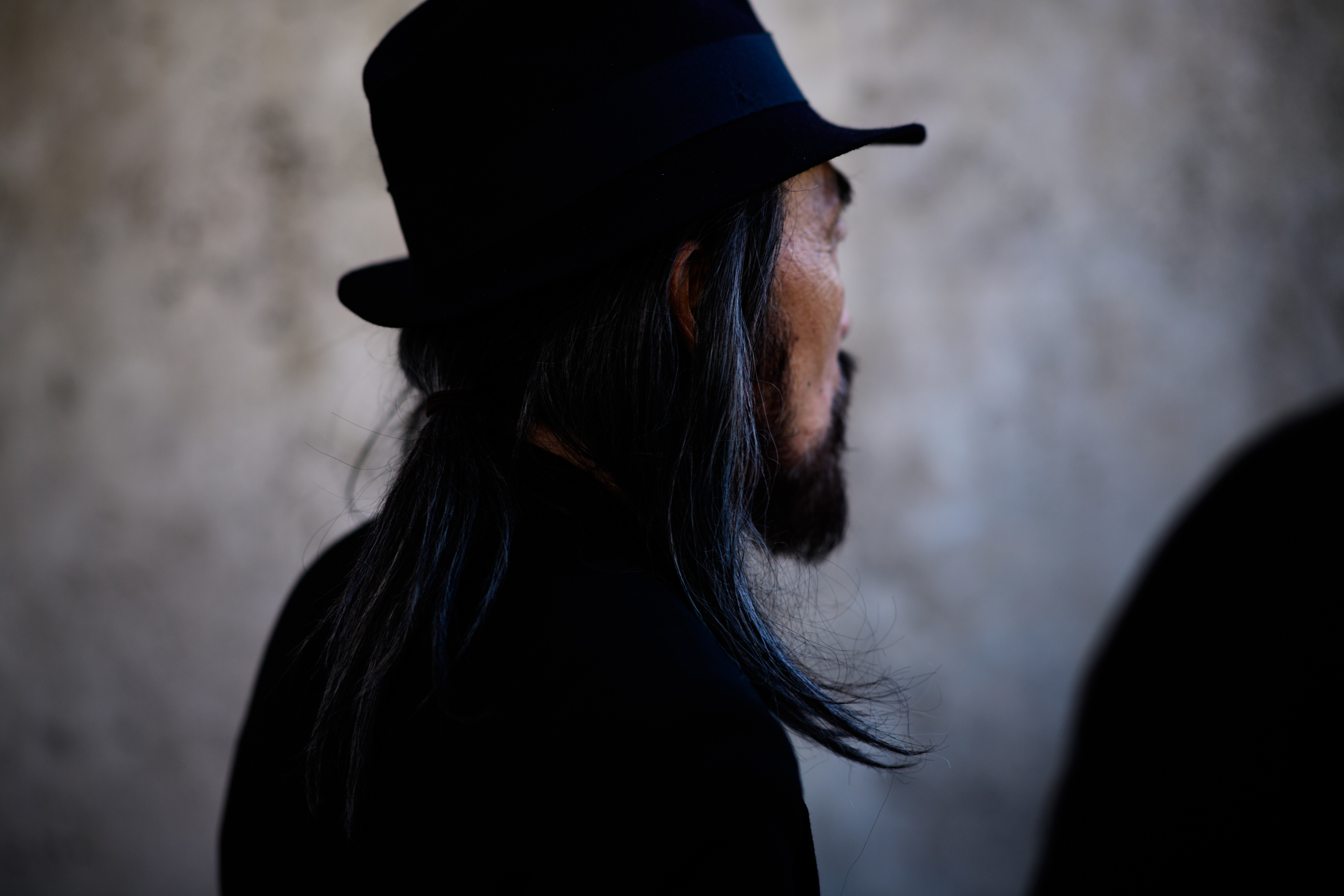 Asian man with long hair
