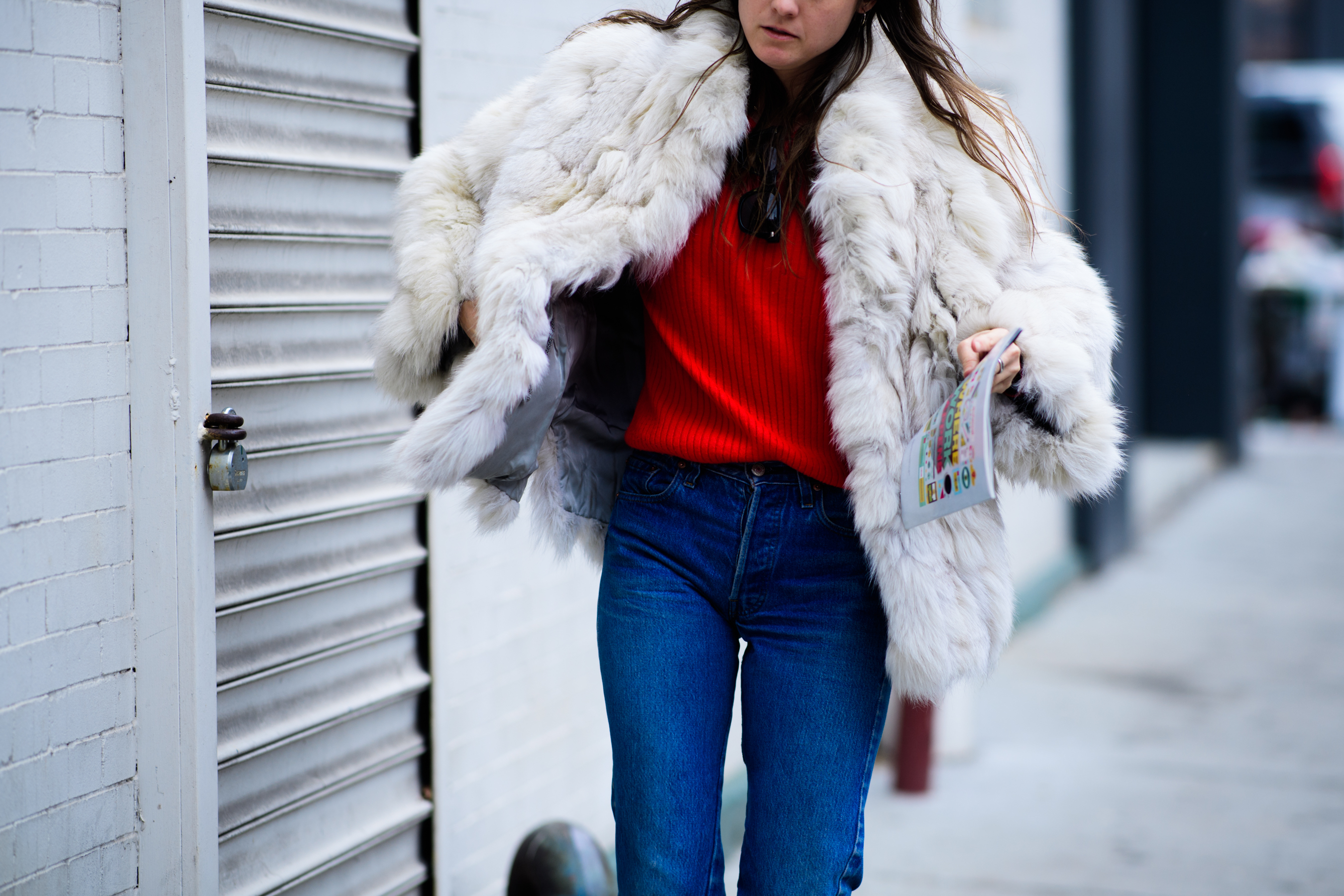 Woman wearing white fur coat