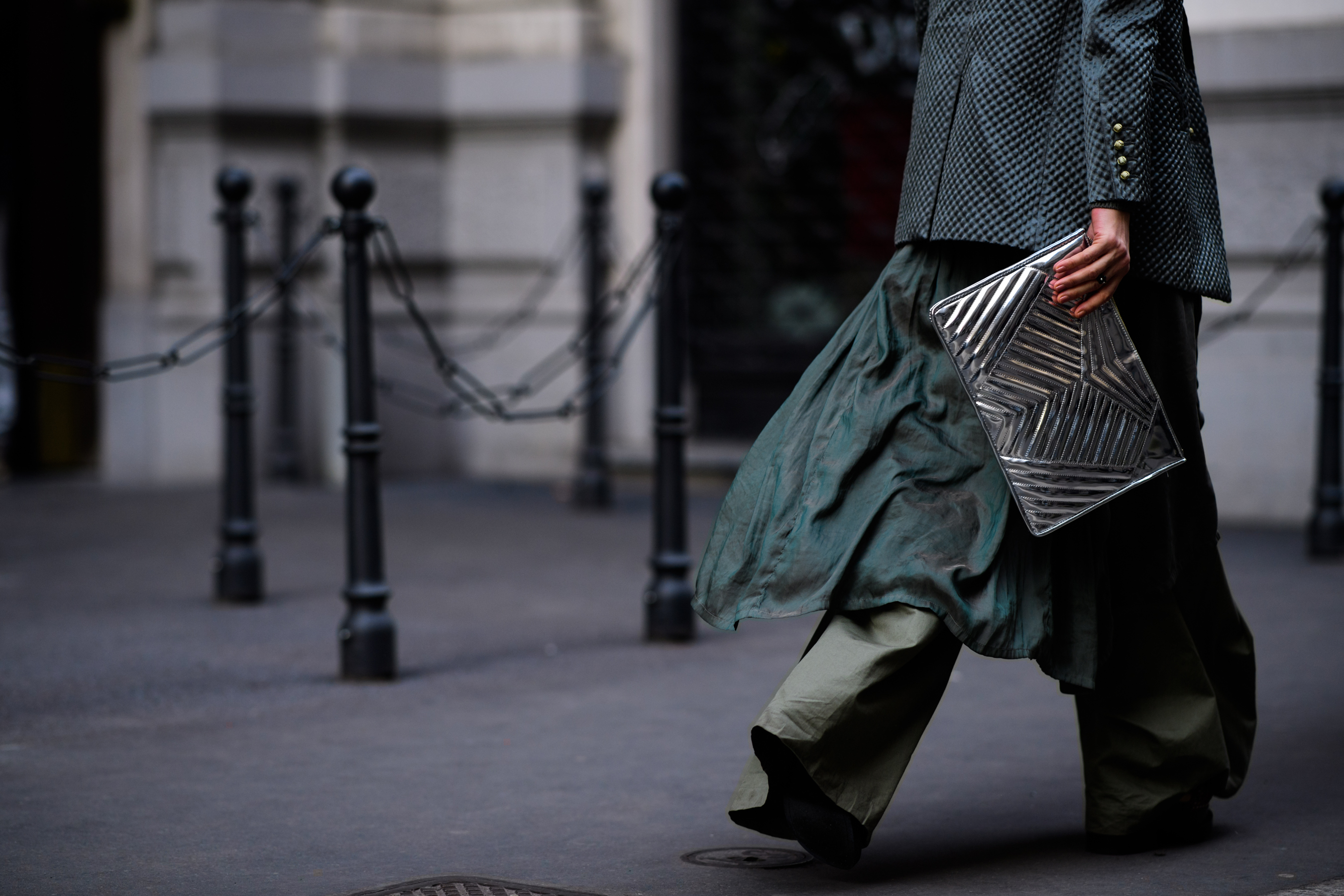 Italian stylist with silvers clutch