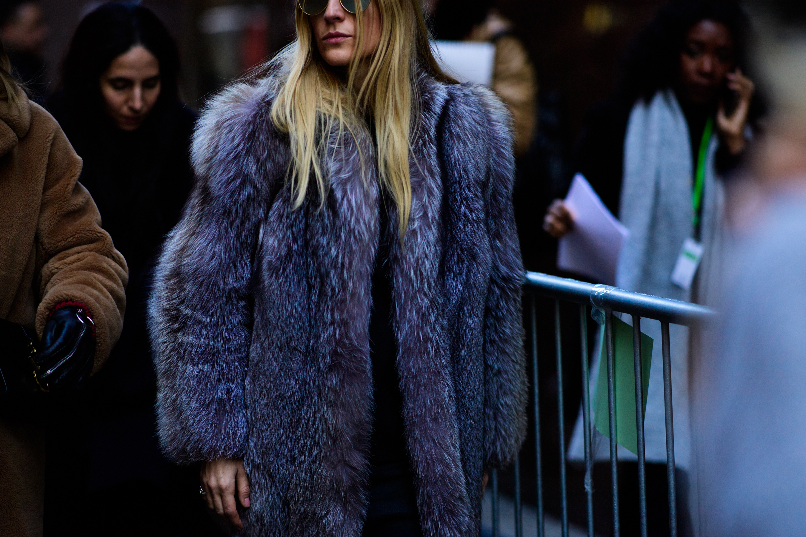 Woman wearing grey fur coat