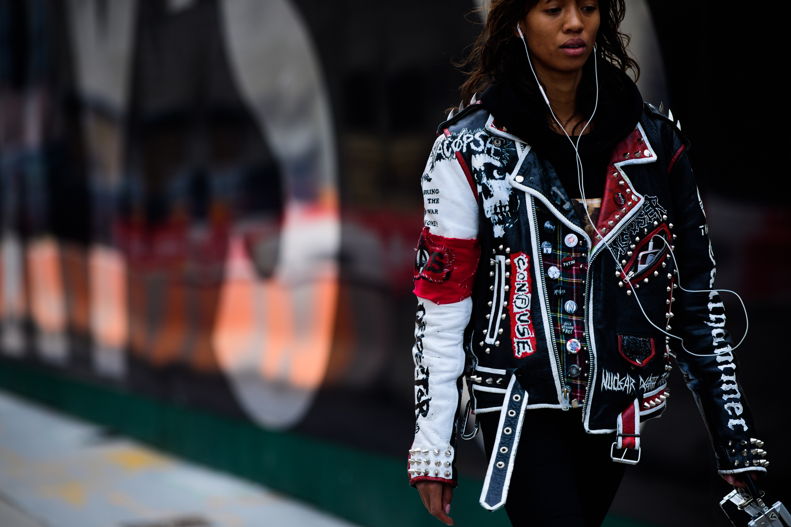 Woman wearing punk leather jacket