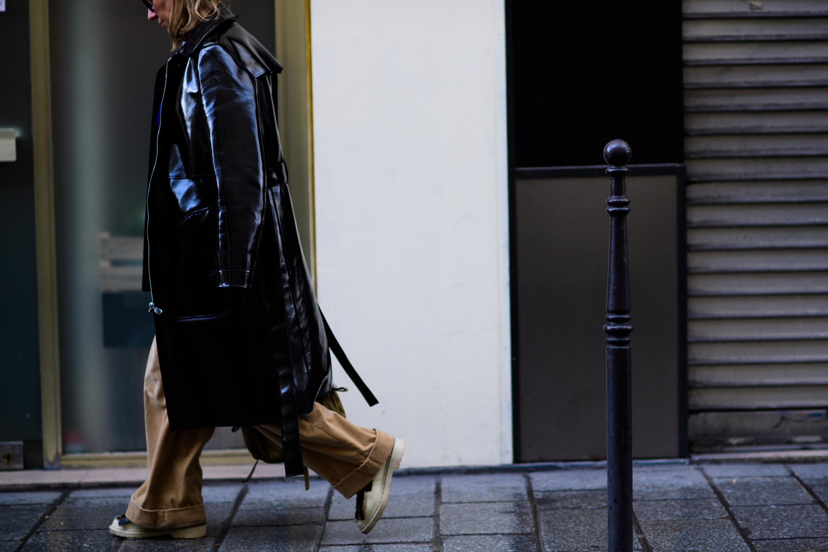 Woman wearing shiny leather coat