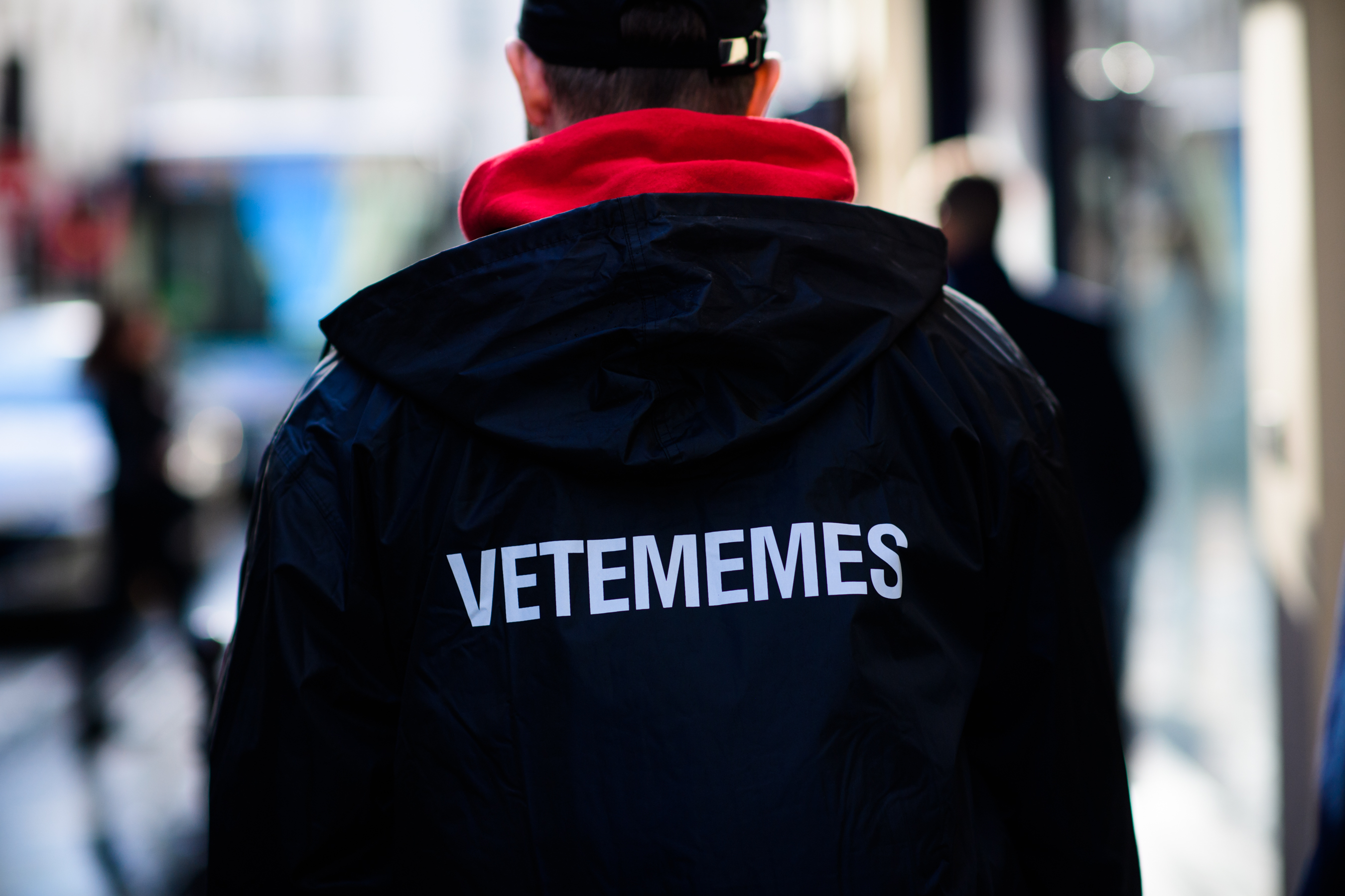 Man wearing Vetememes rain coat