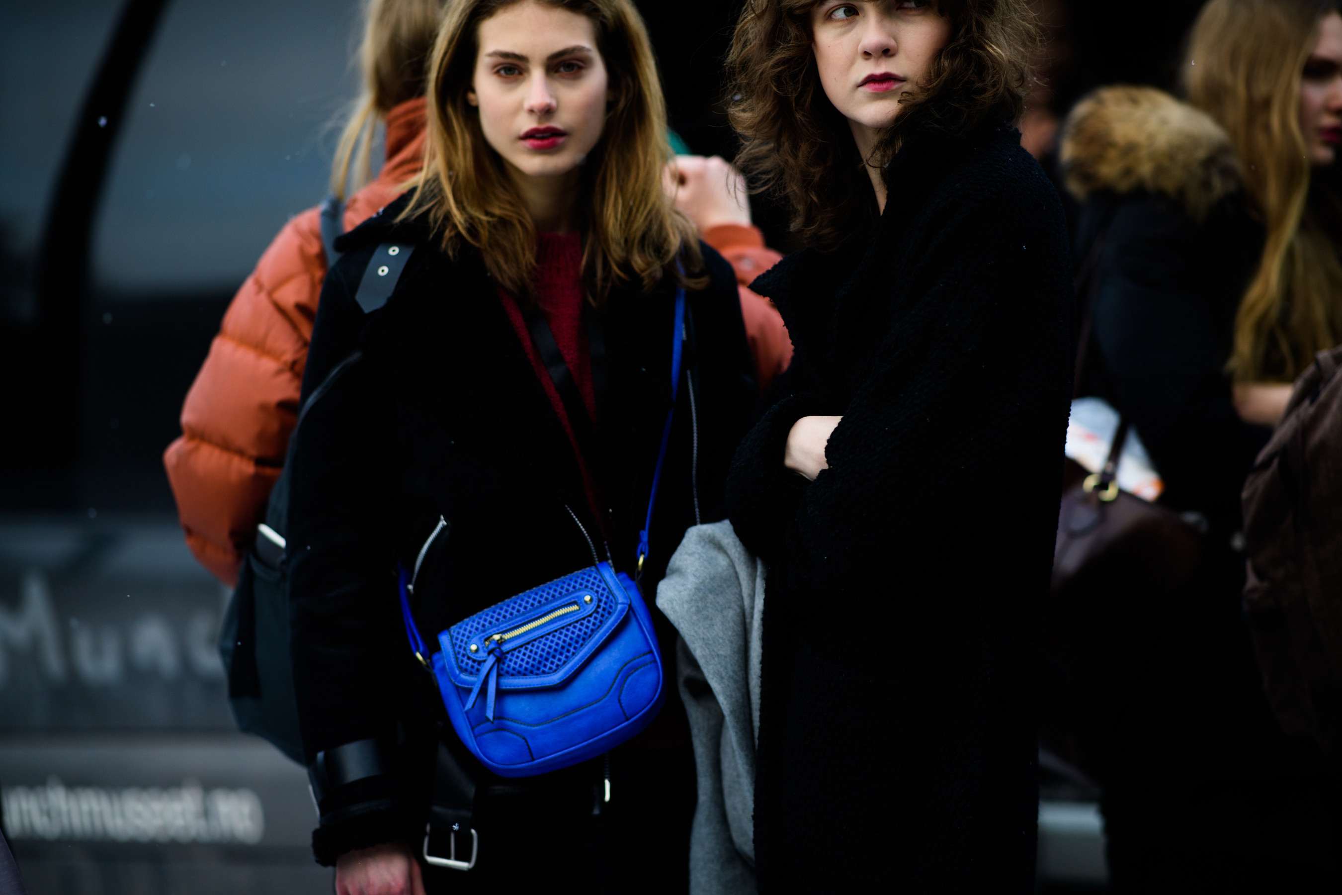 Woman with blue handbag