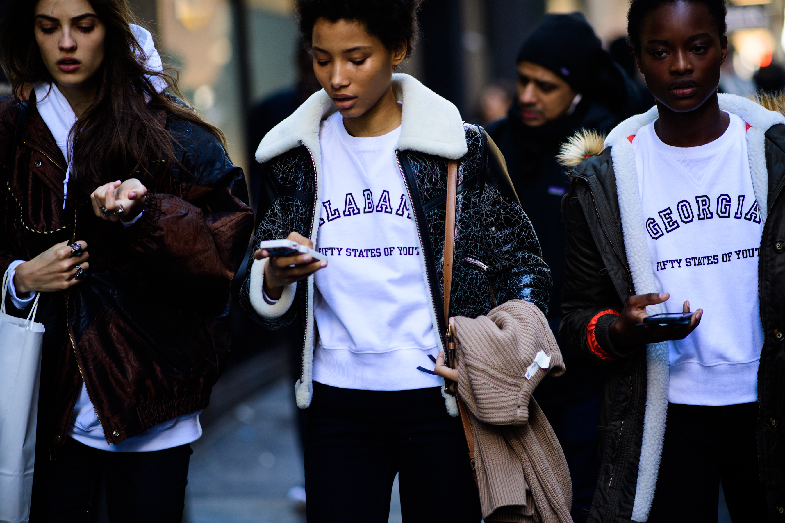 Models wearing white hoodies