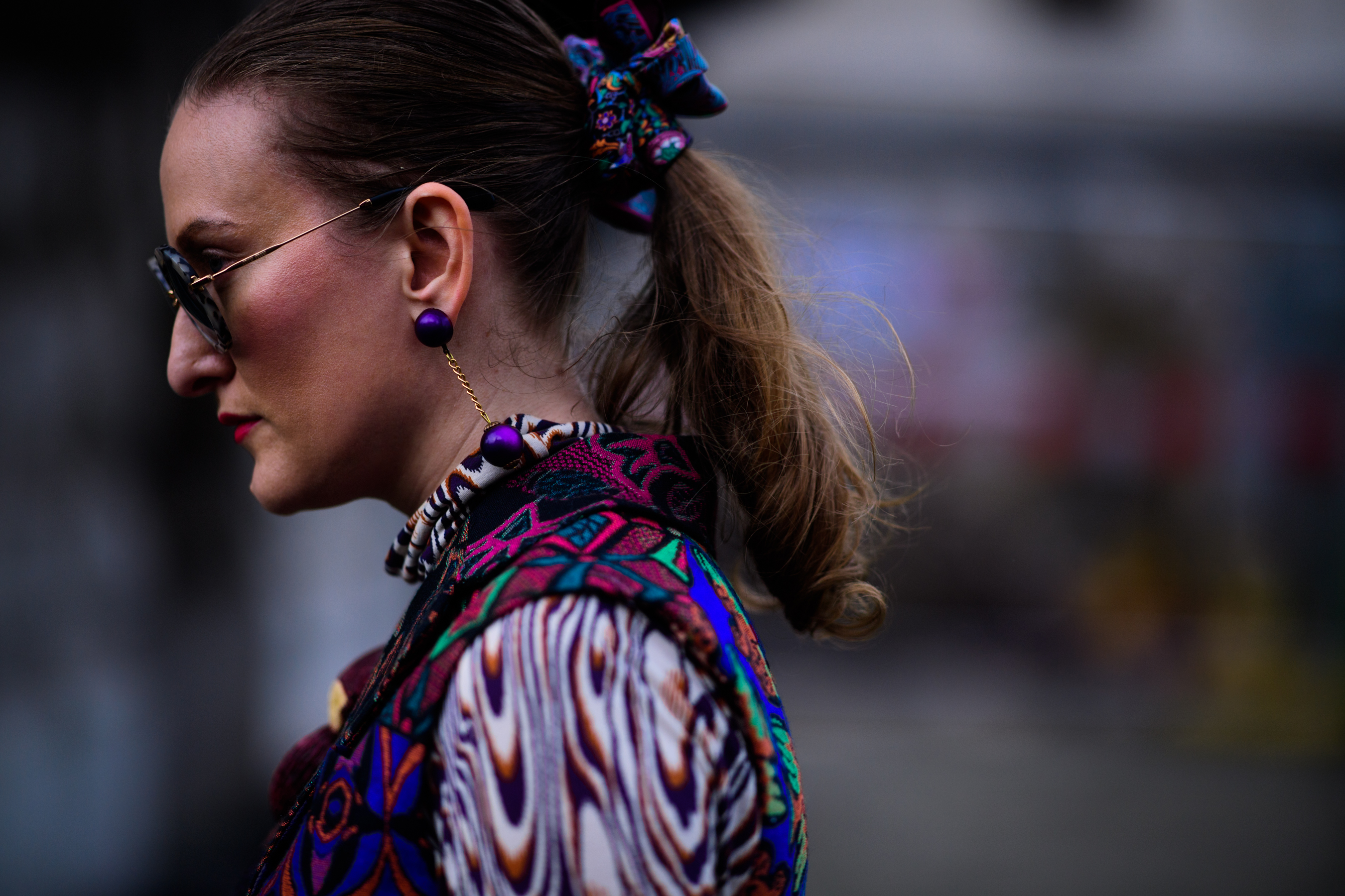 Woman wearing purple earring