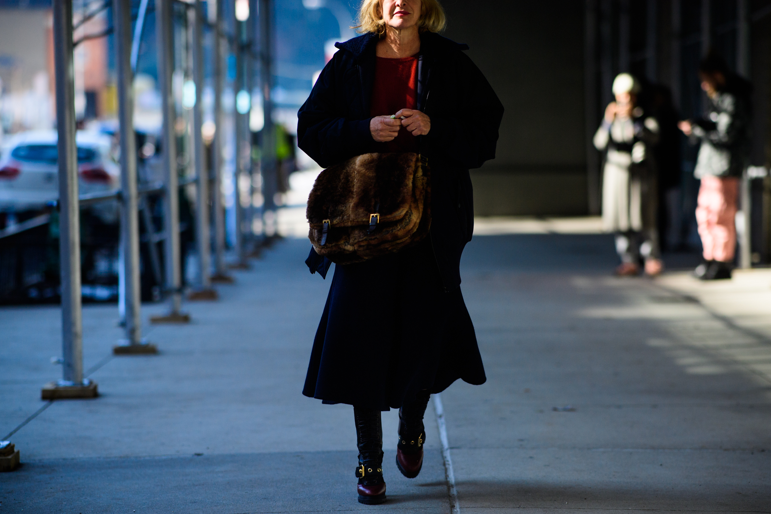 Woman wearing fur bag