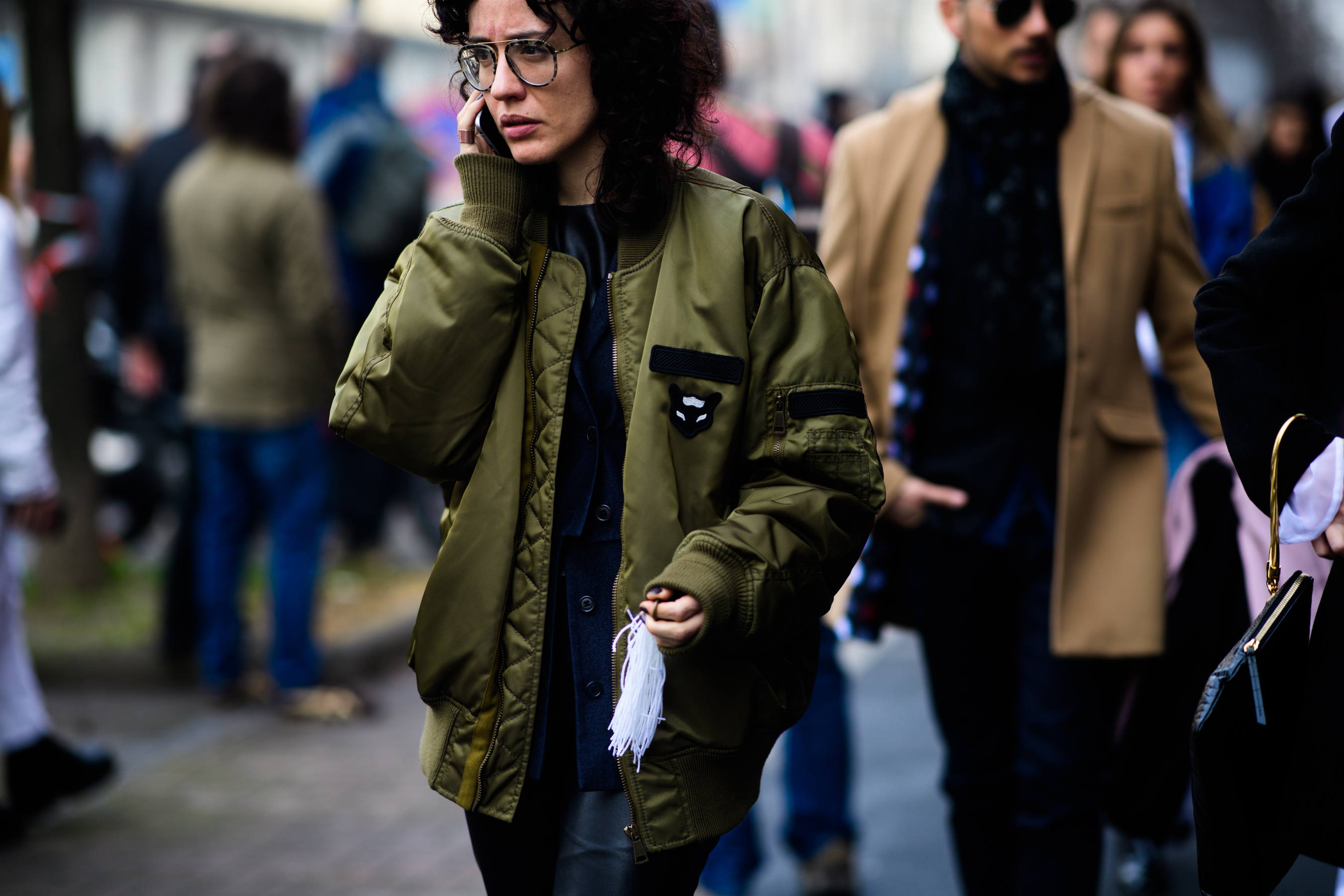 Woman wearing green bomber jacket