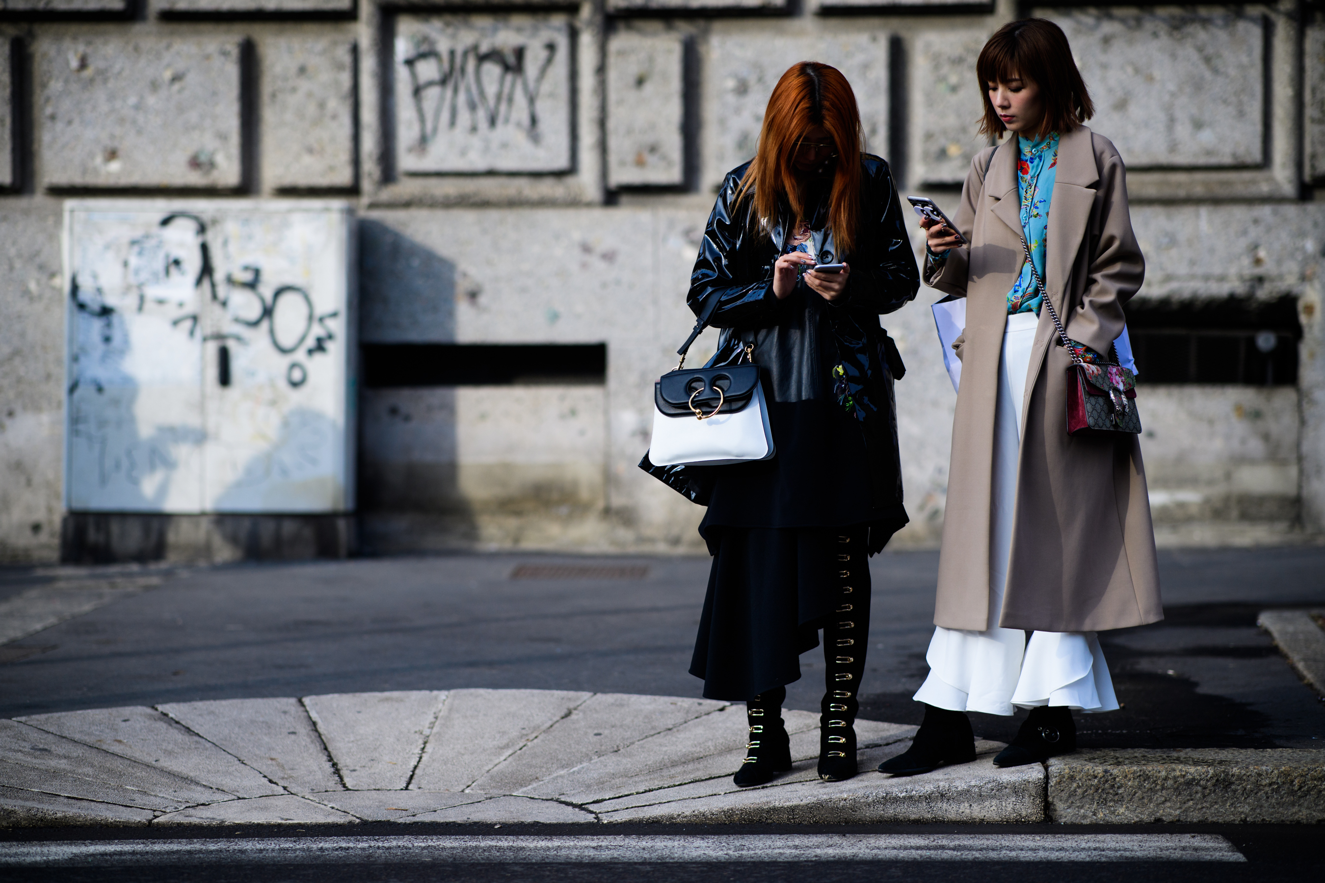 Two women with J.W.Anderson and Gucci bags