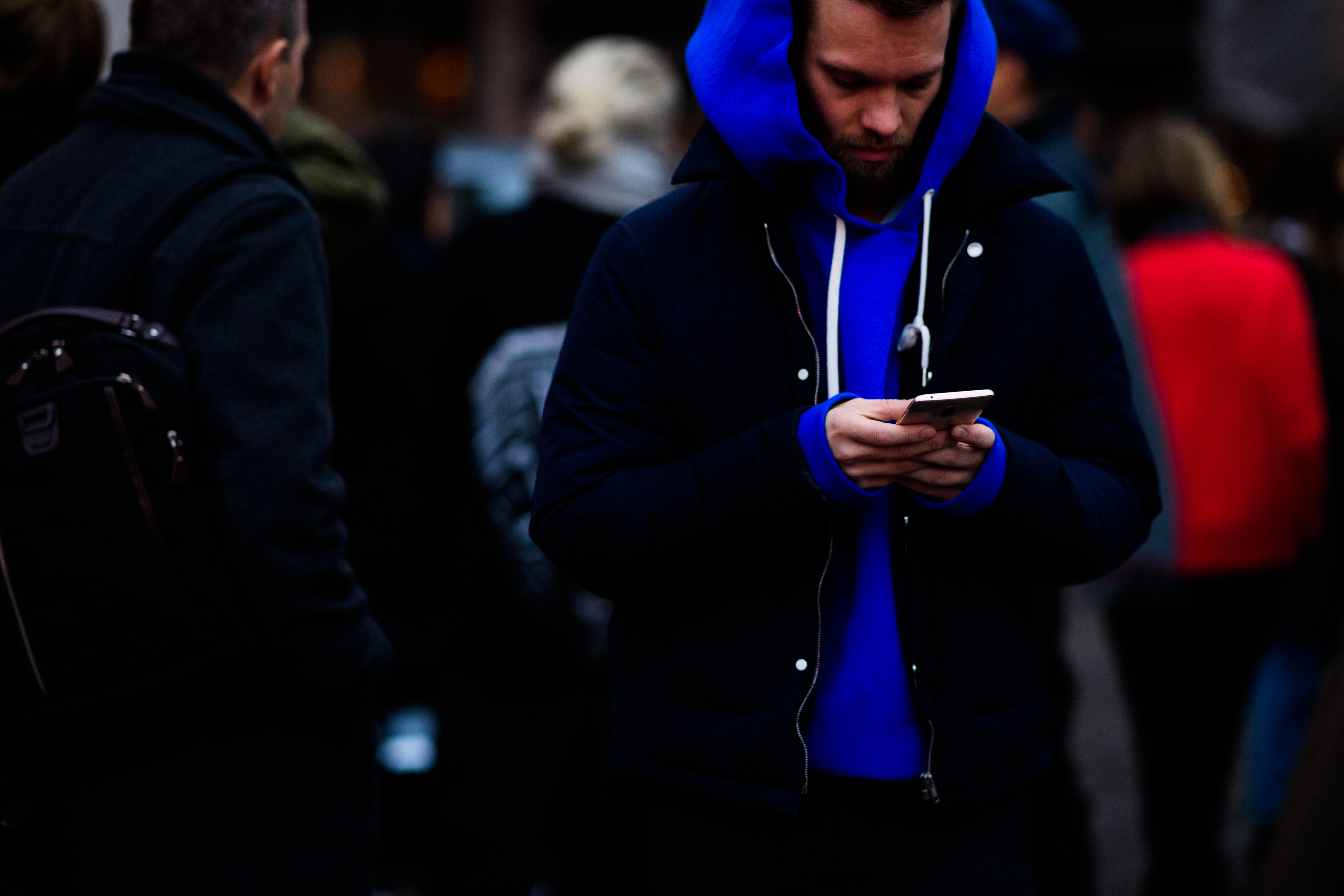 Man wearing blue hoodie