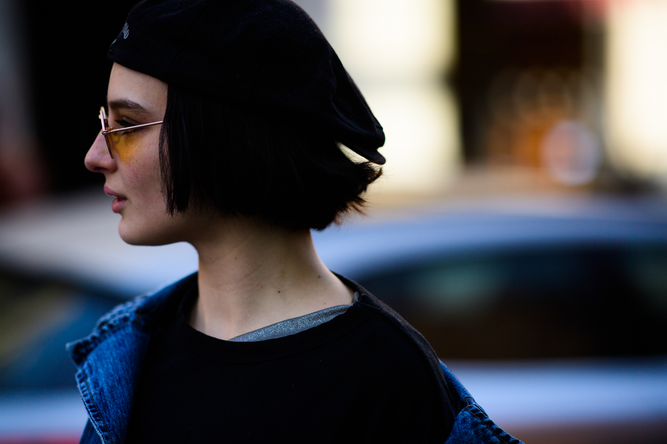 Model wearing hat and sunglasses