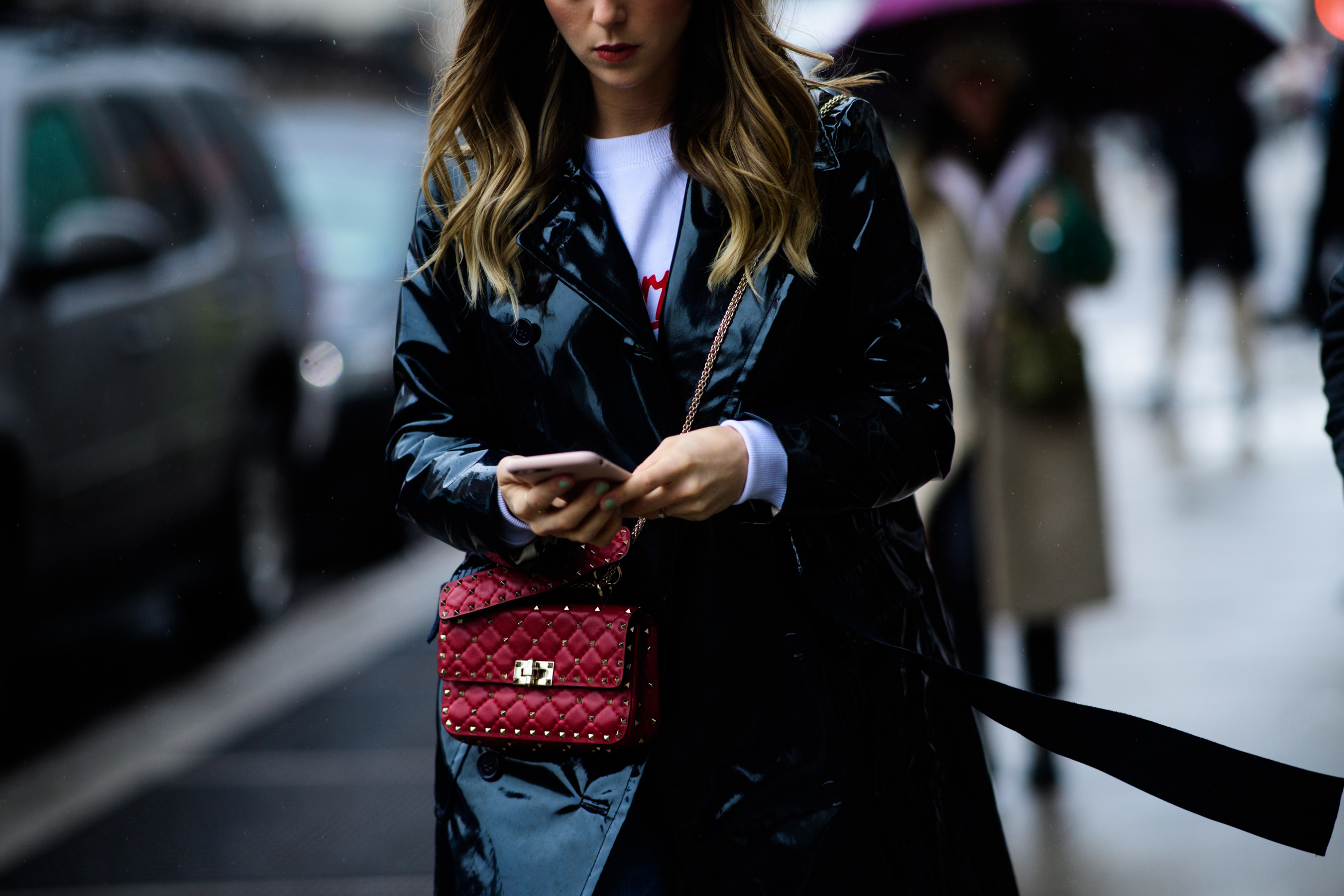 Woman wearing shiny leather jacket