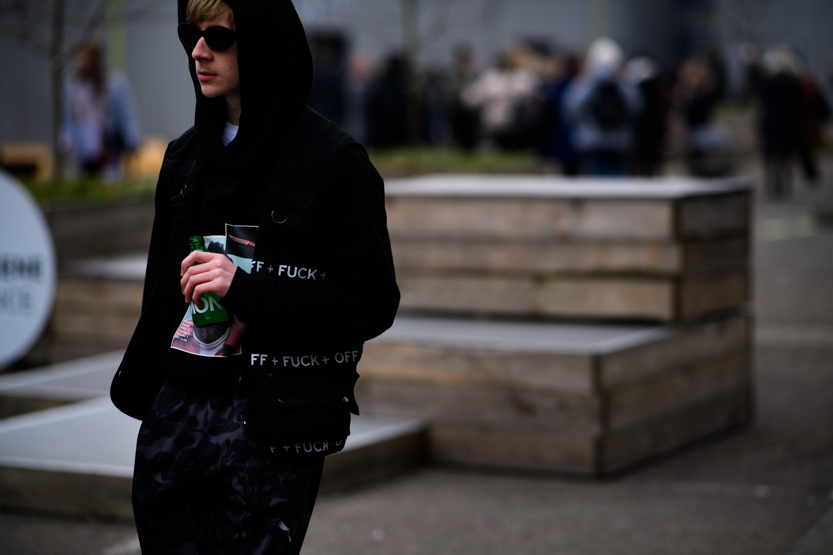 Man wearing sunglasses and black clothes