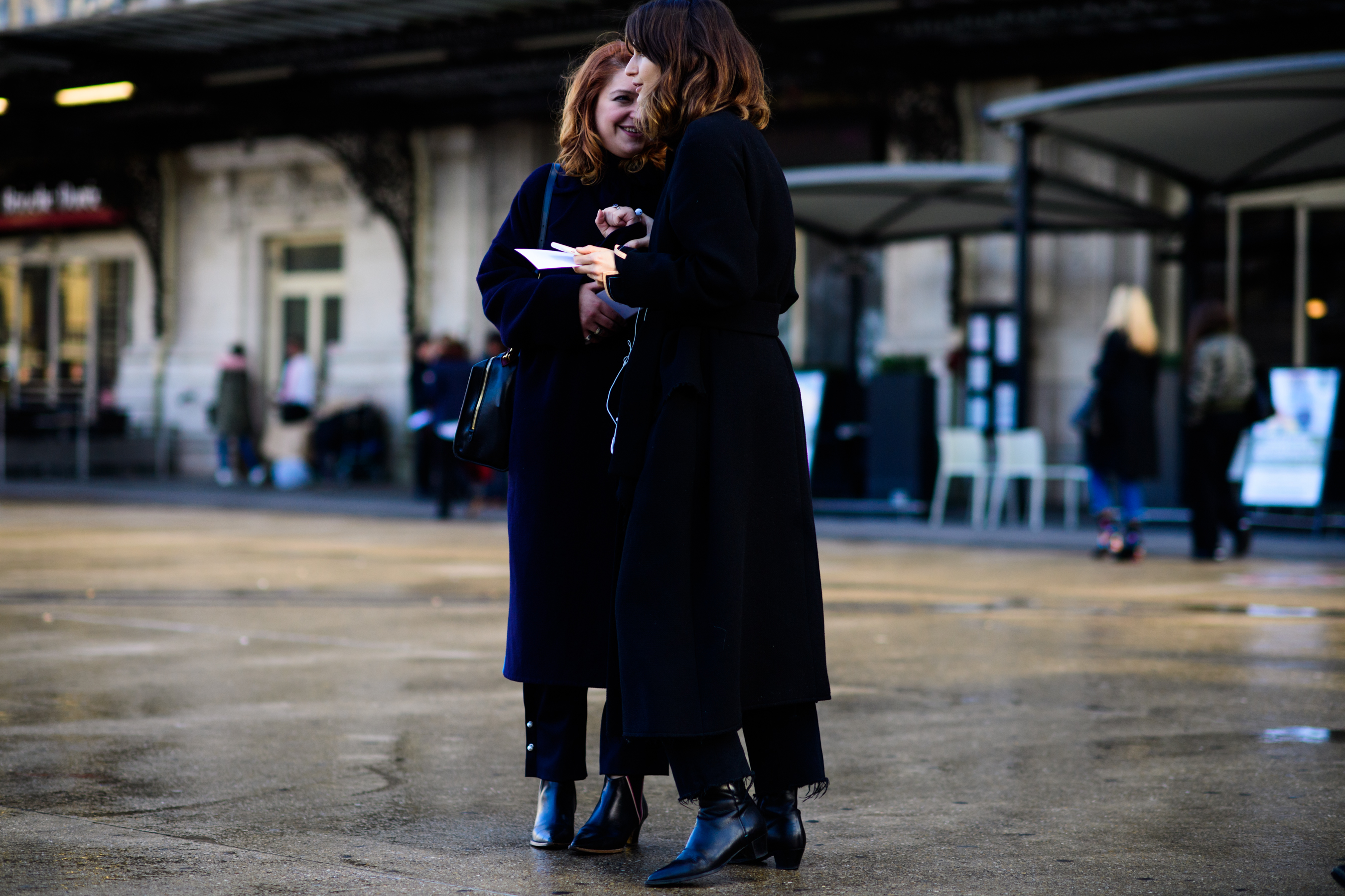 Two women wearing all black
