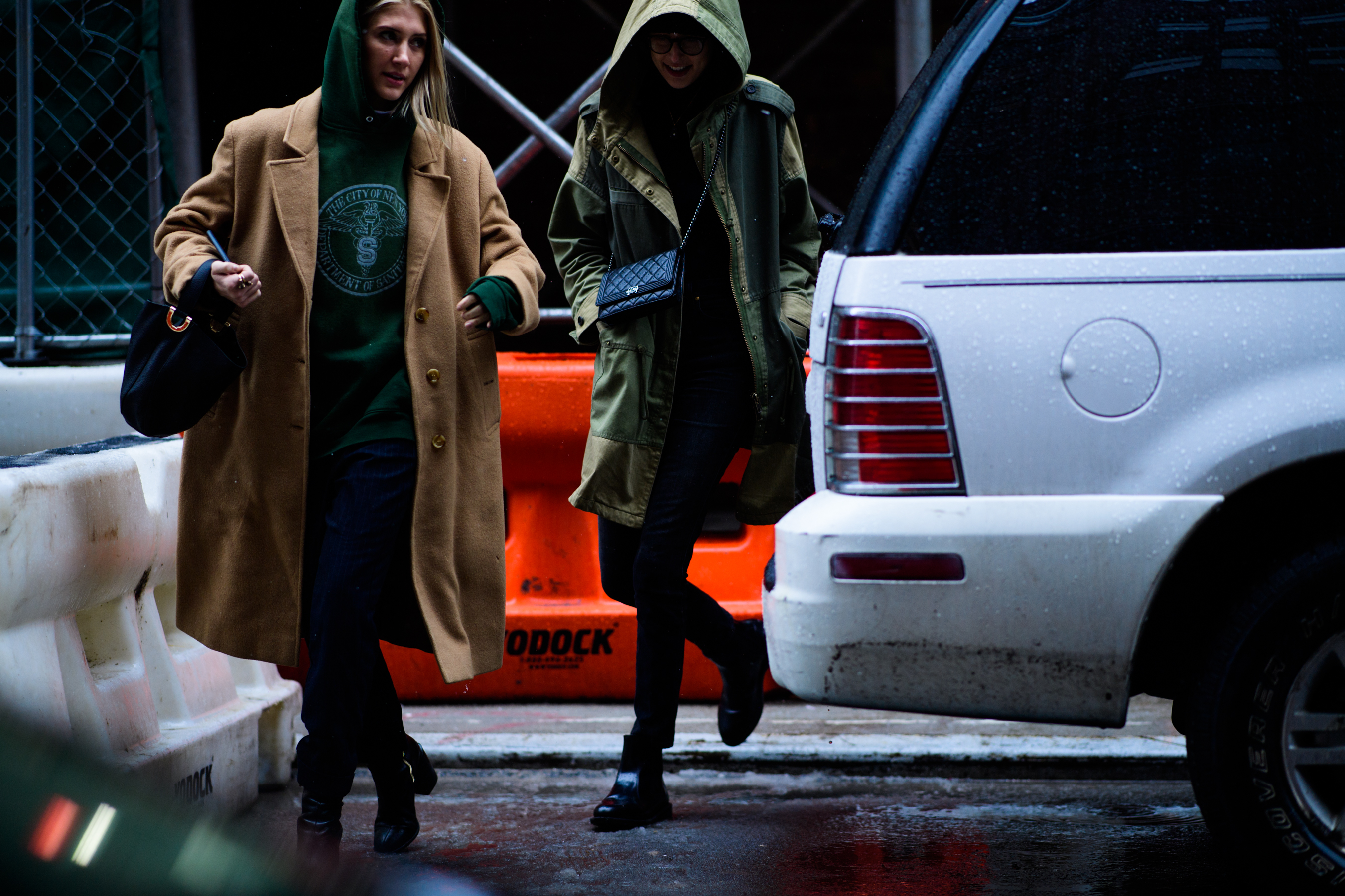 Two women wearing green