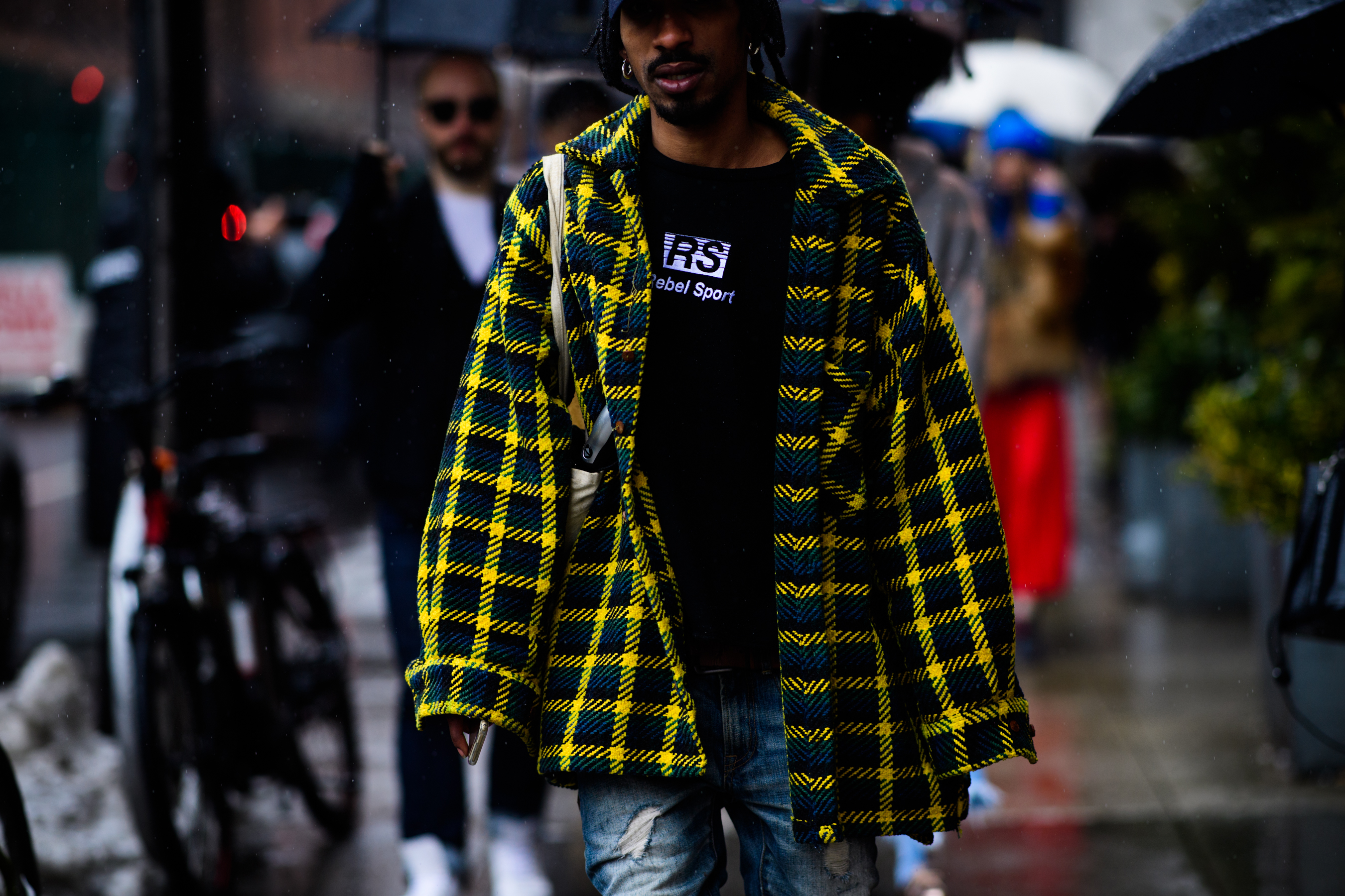 Man wearing yellow tartan oversized shirt