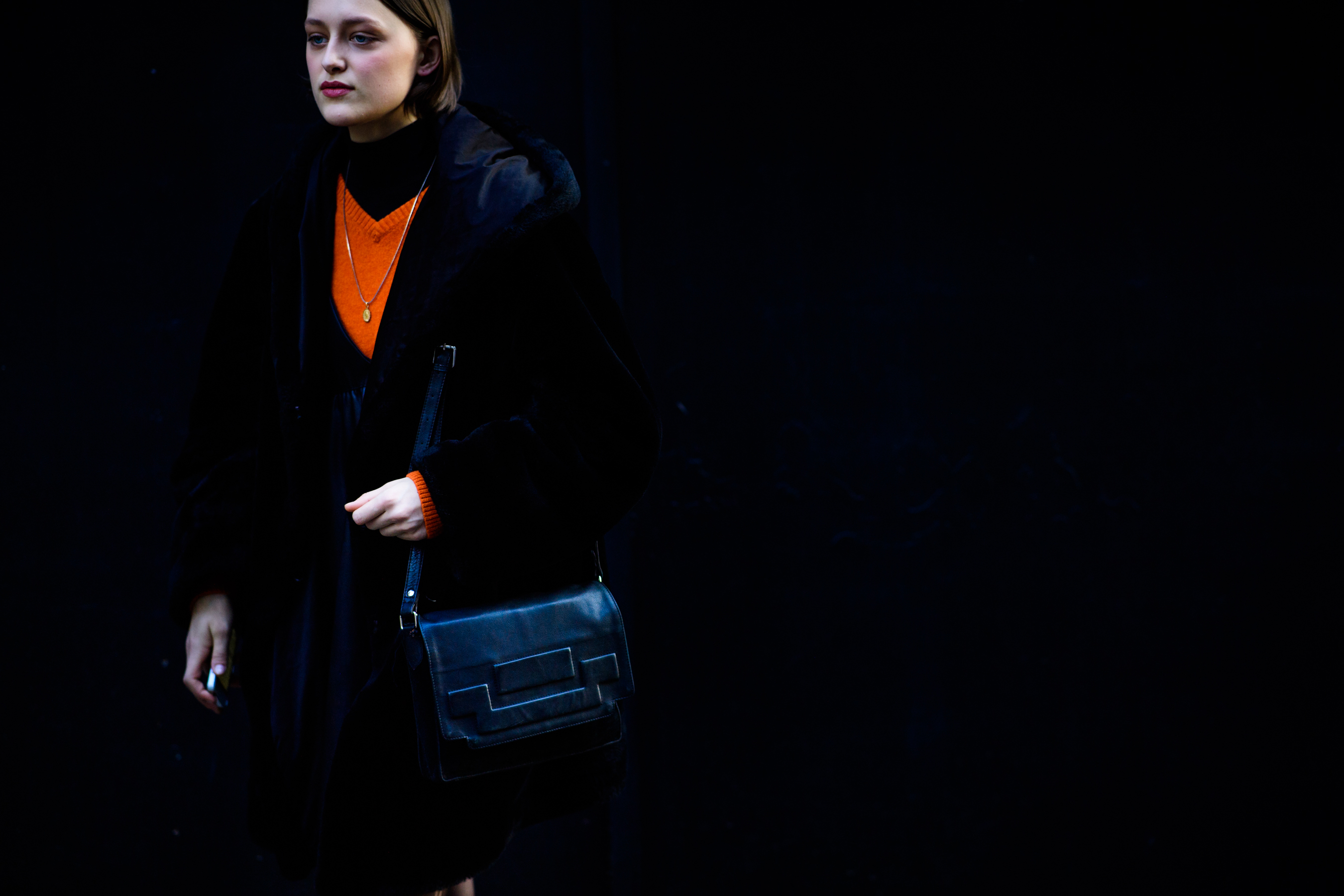 Model with black shoulder bag