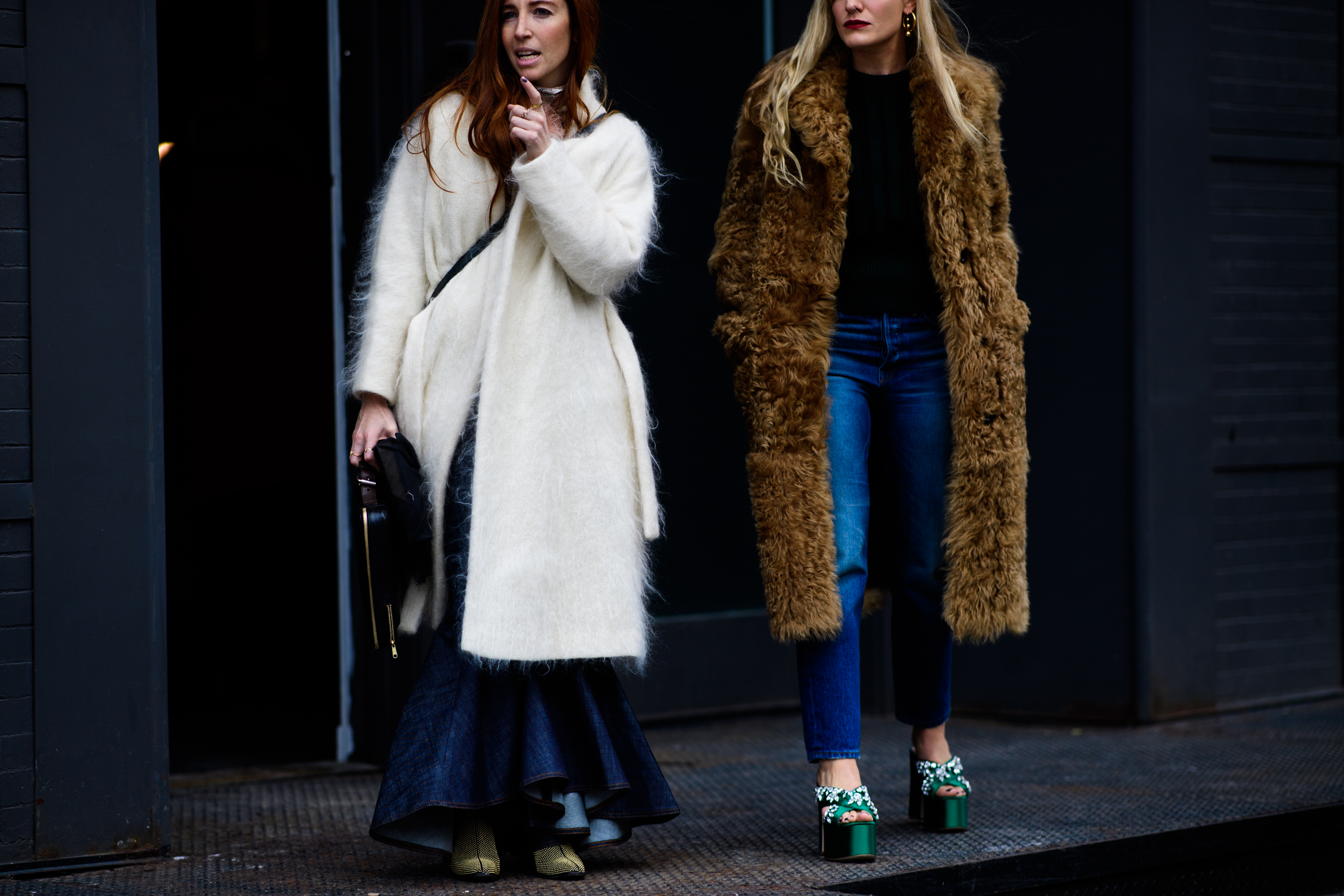 Two women wearing warm coats