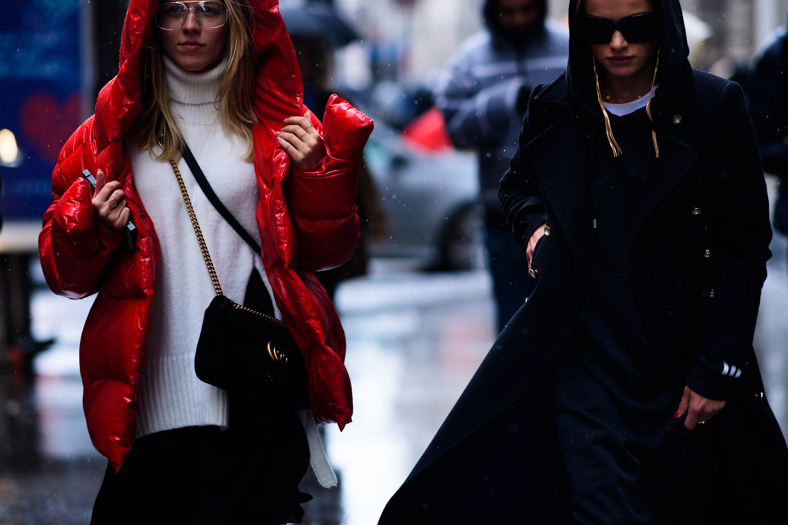 Two women wearing red and black