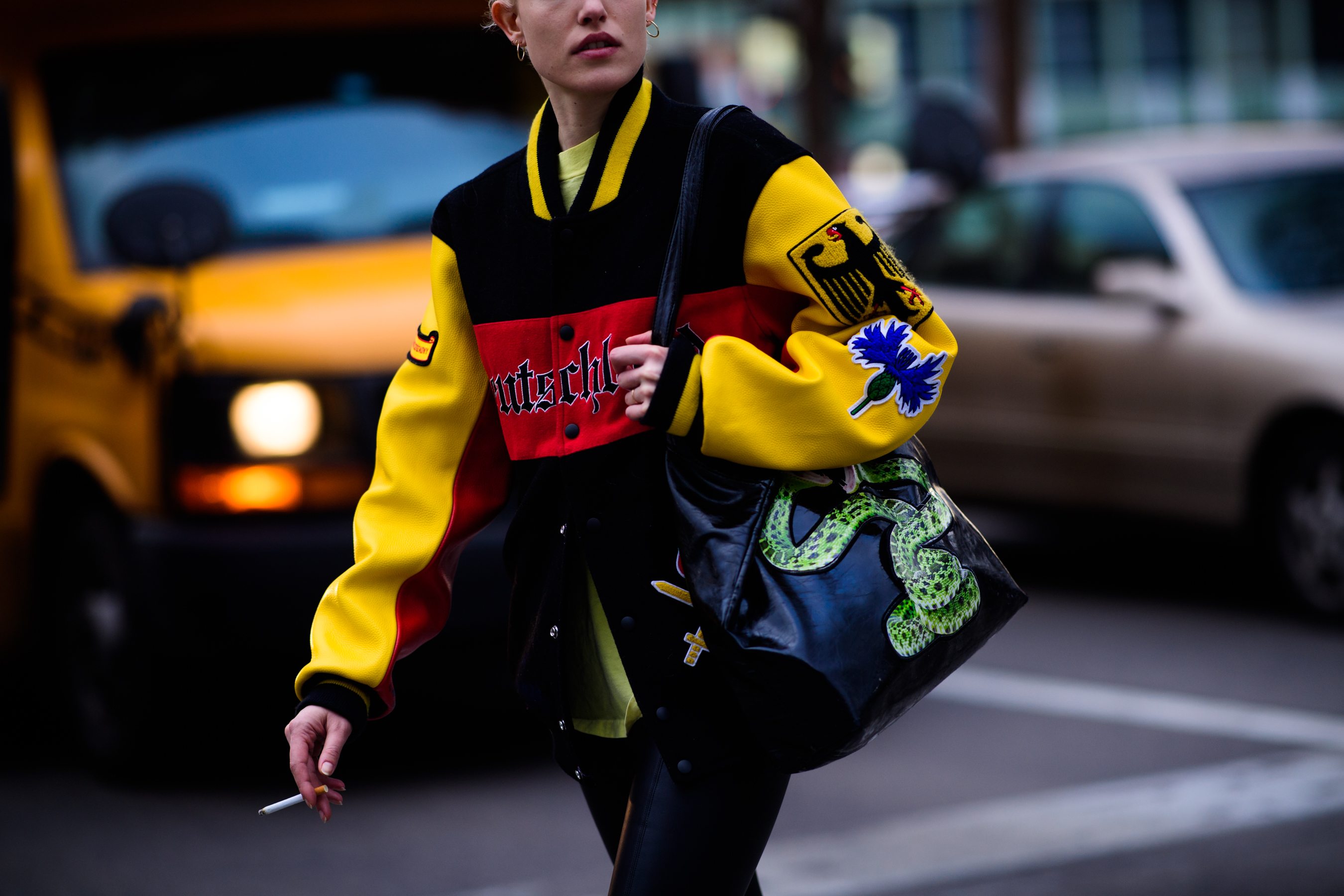 Woman wearing bag with a snake