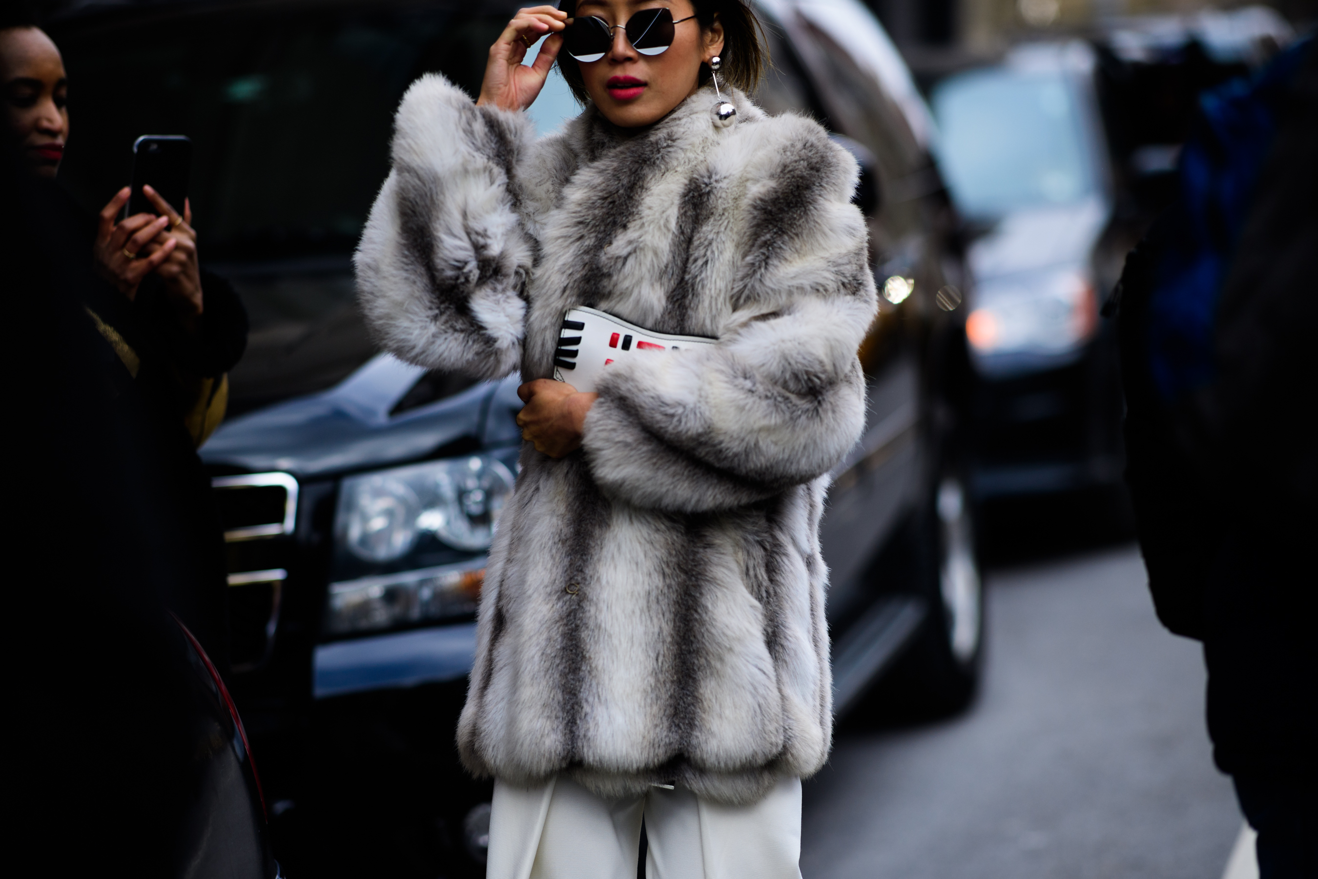 Blogger wearing grey fur coat