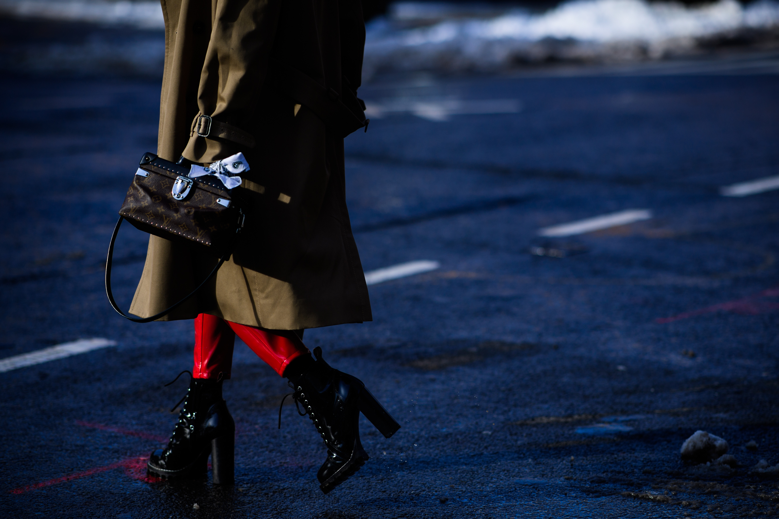 Woman with Louis Vuitton shoes and bag