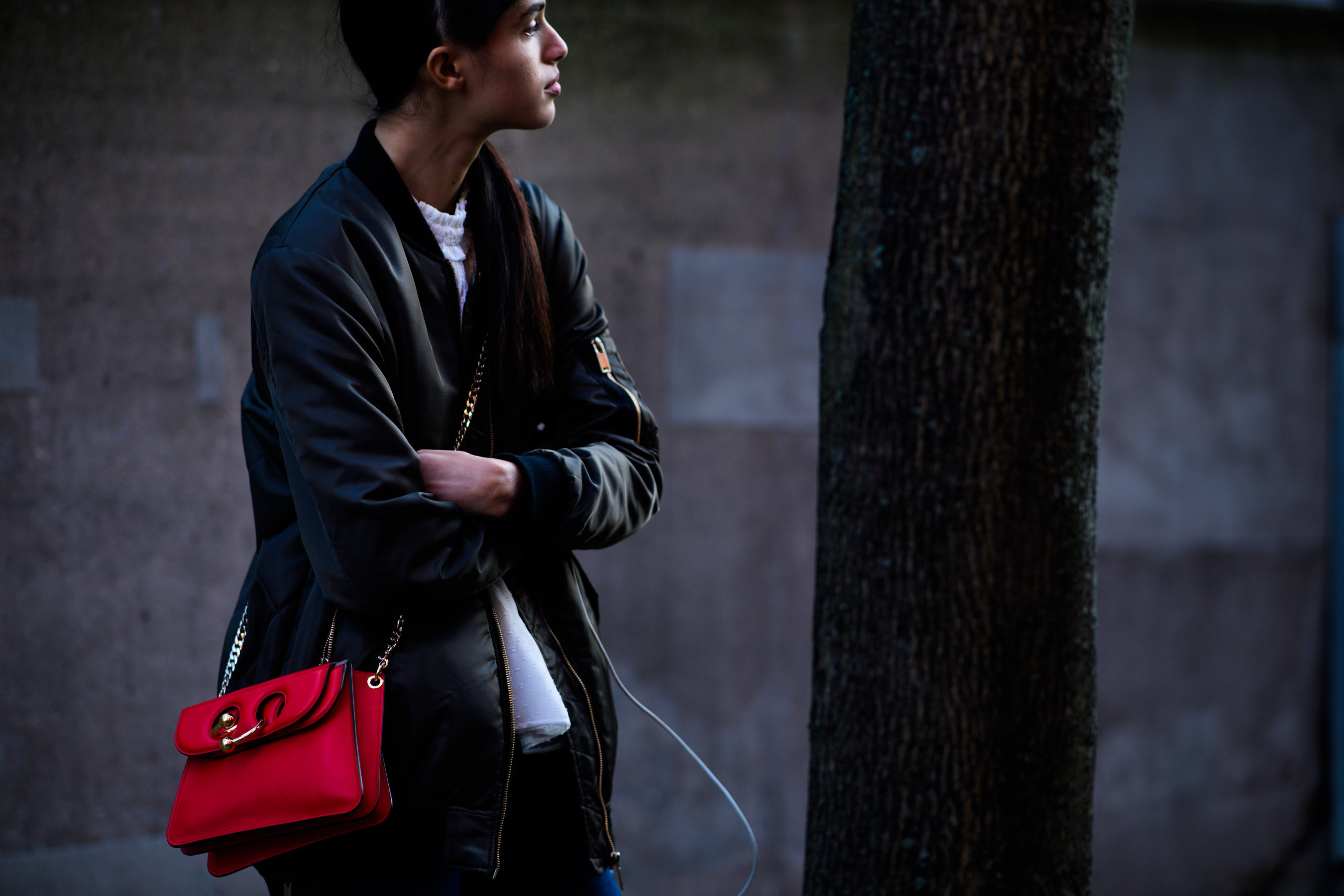 Model wearing J.W.Andersin red bag