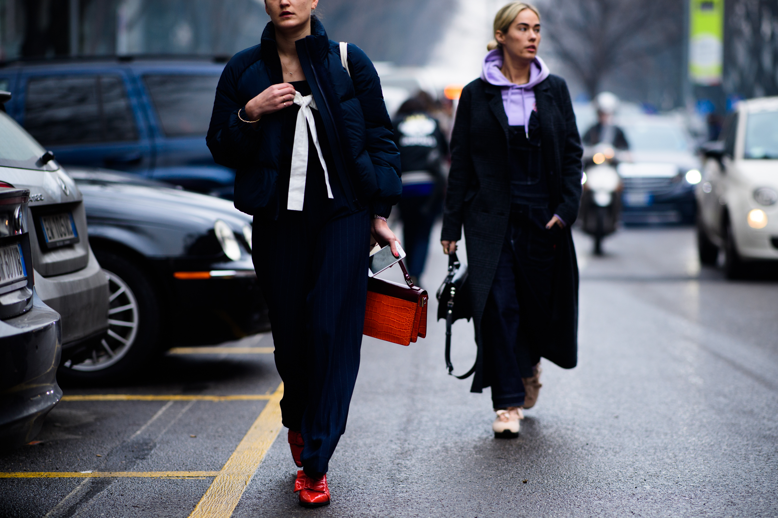 Two women wearing dark clothes