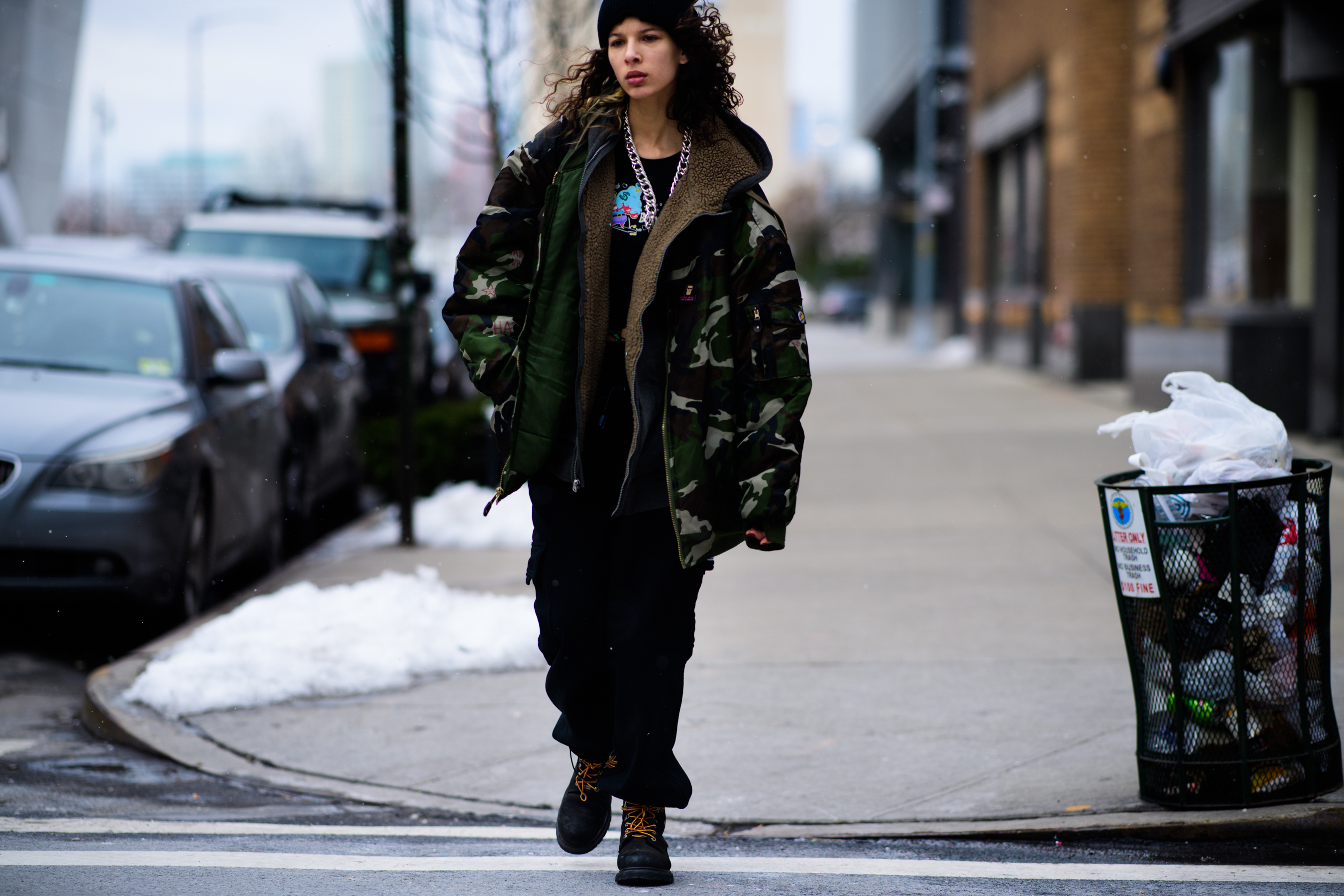 Model wearing oversized camo jacket