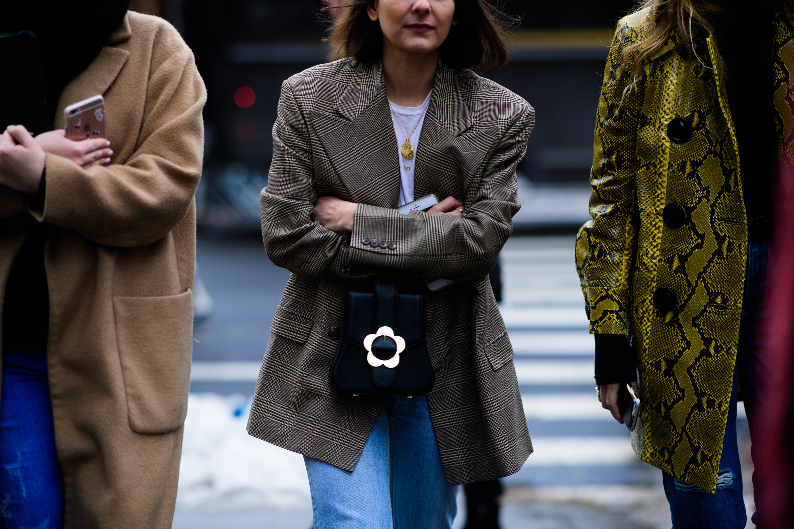 Woman wearing jacket and blue pants