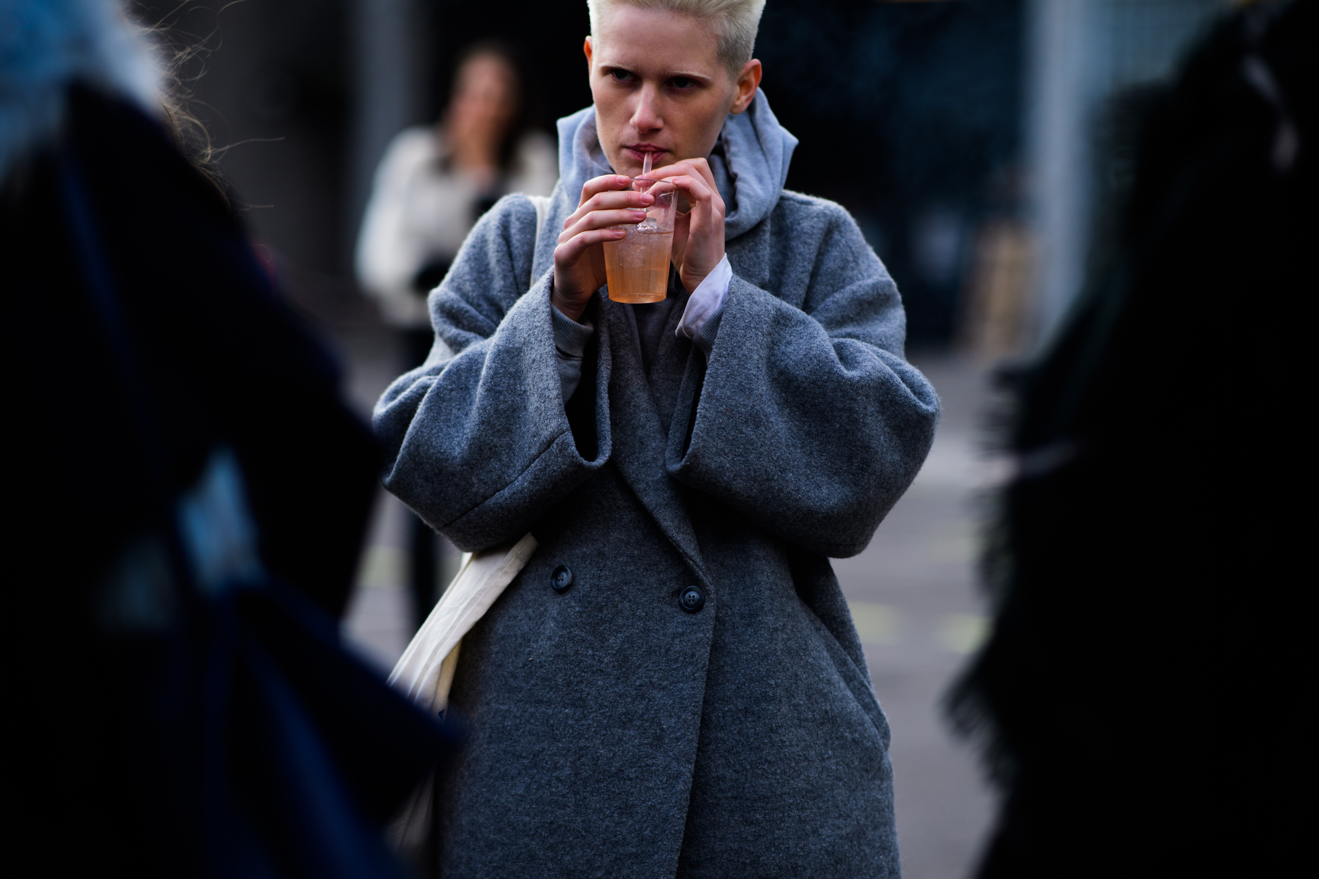Woman wearing grey coat