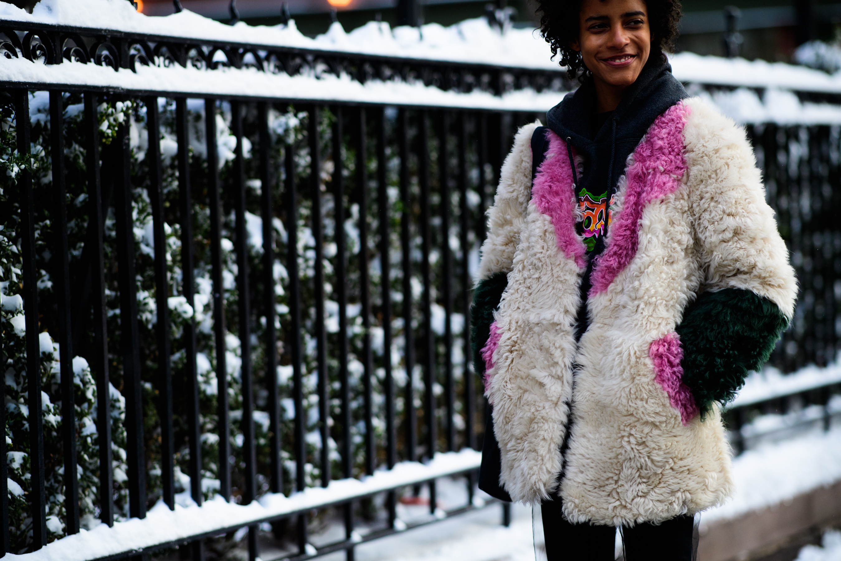 Woman wearing white fur coat