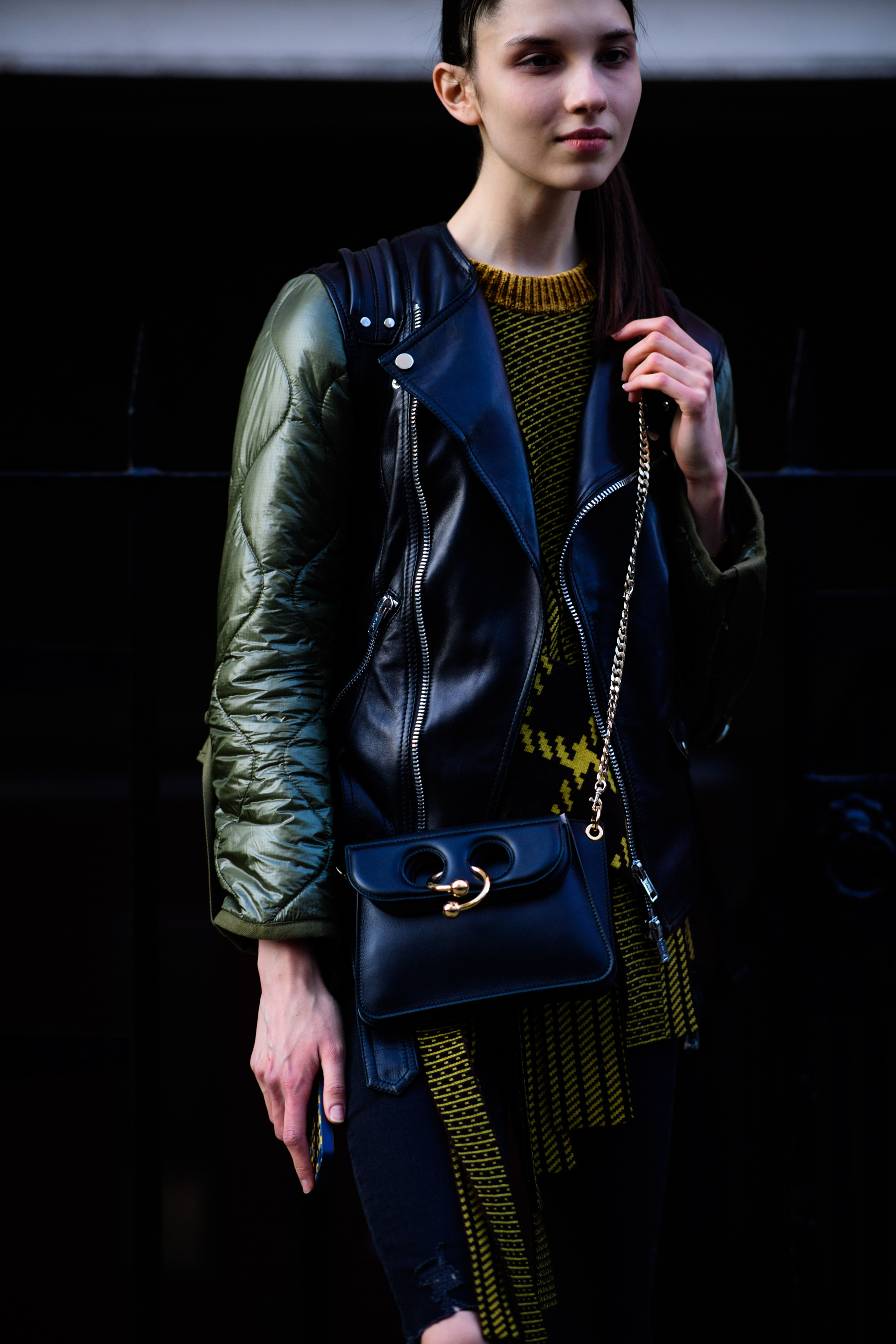 Model wearing black J.W.Anderson bag
