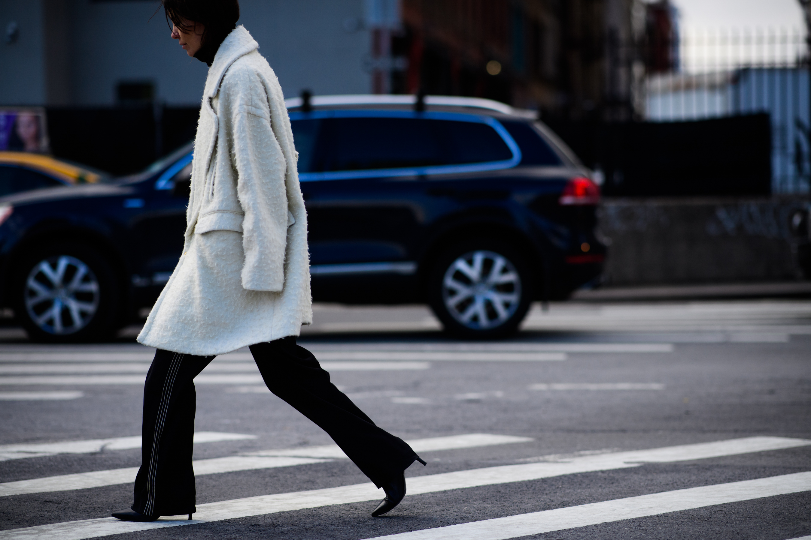 American stylist wearing white coat