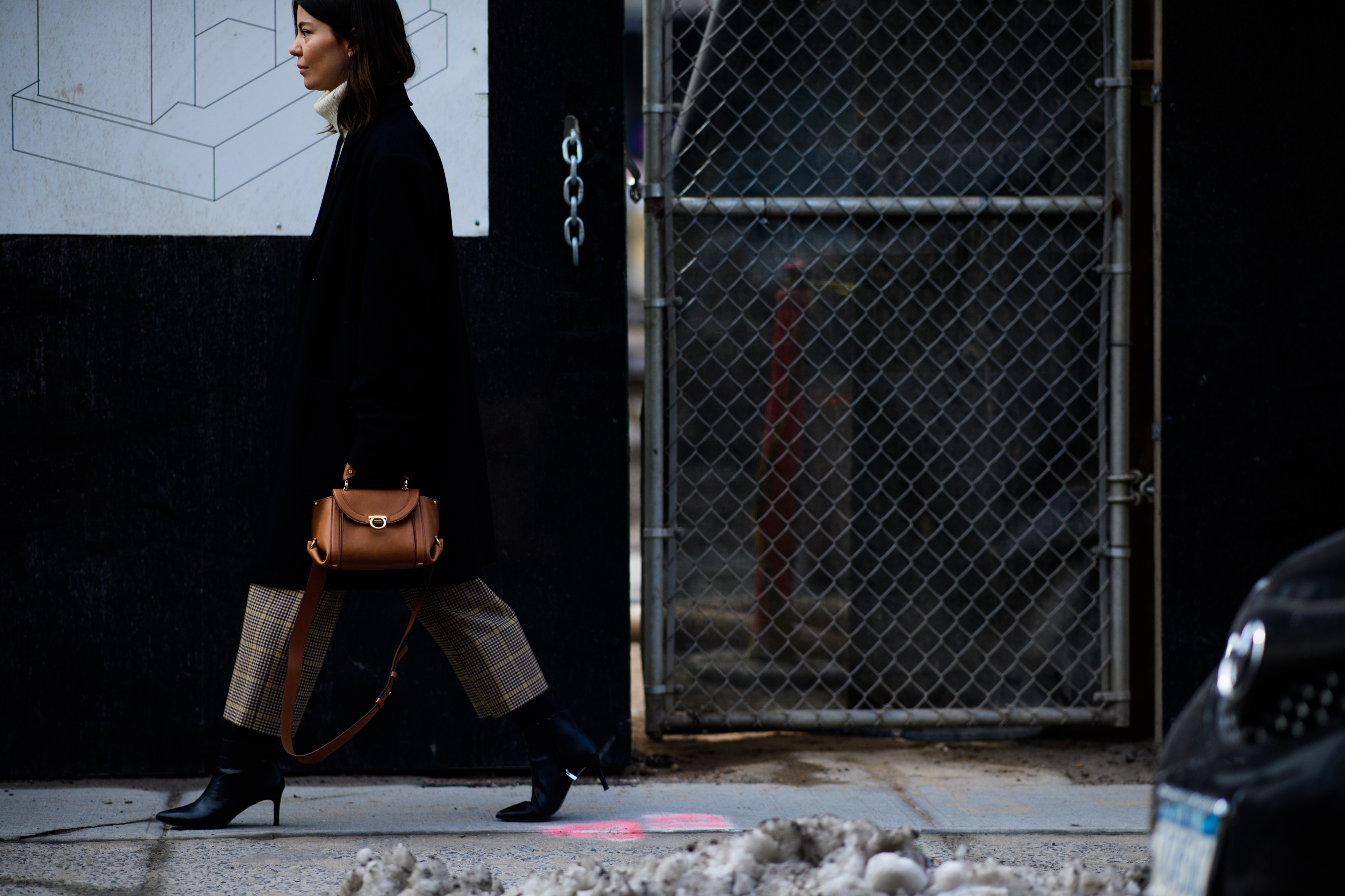 Woman with brown handbag