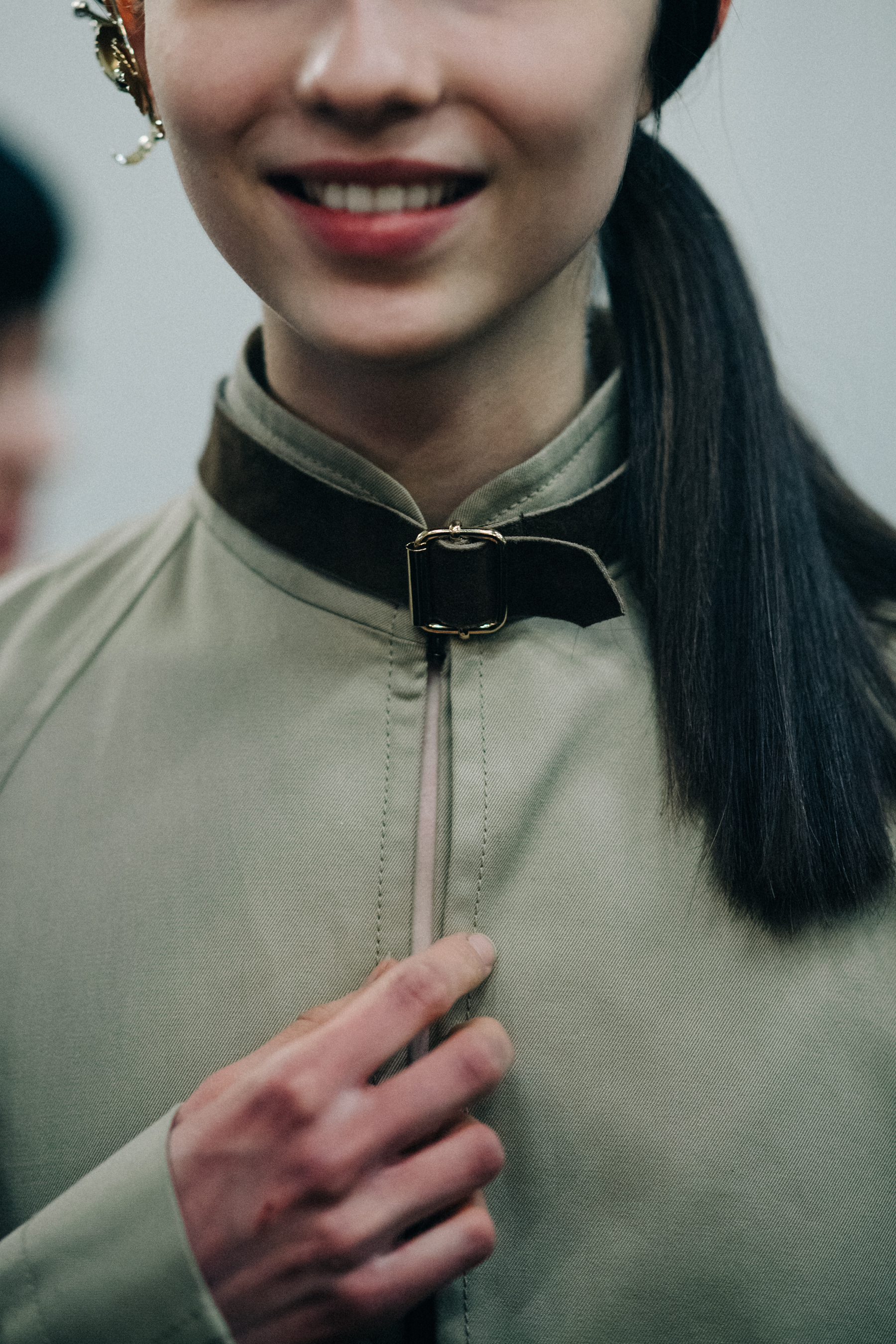 Anastasia Chekry wearing green jacket