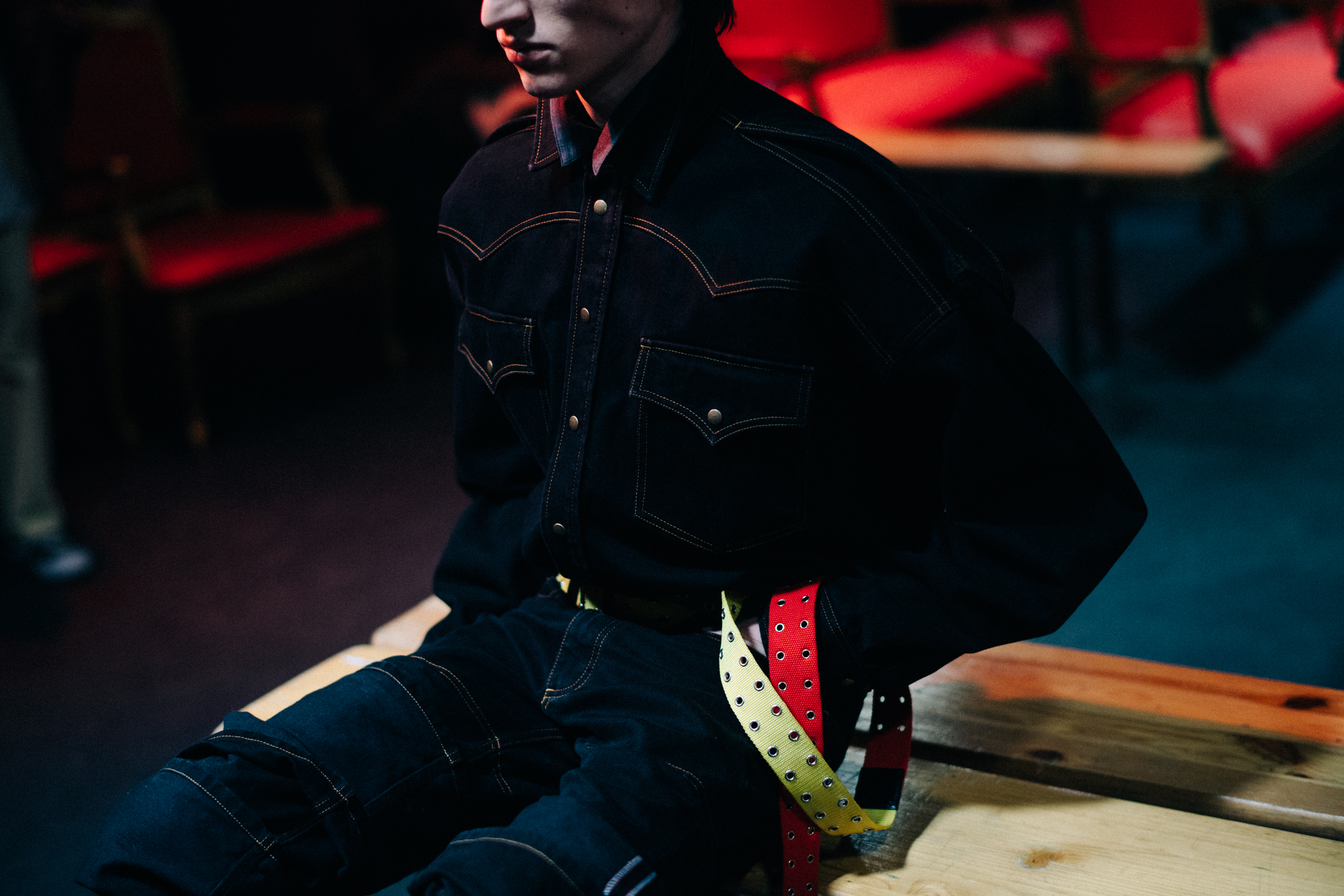 Eliott wearing denim clothes for the show