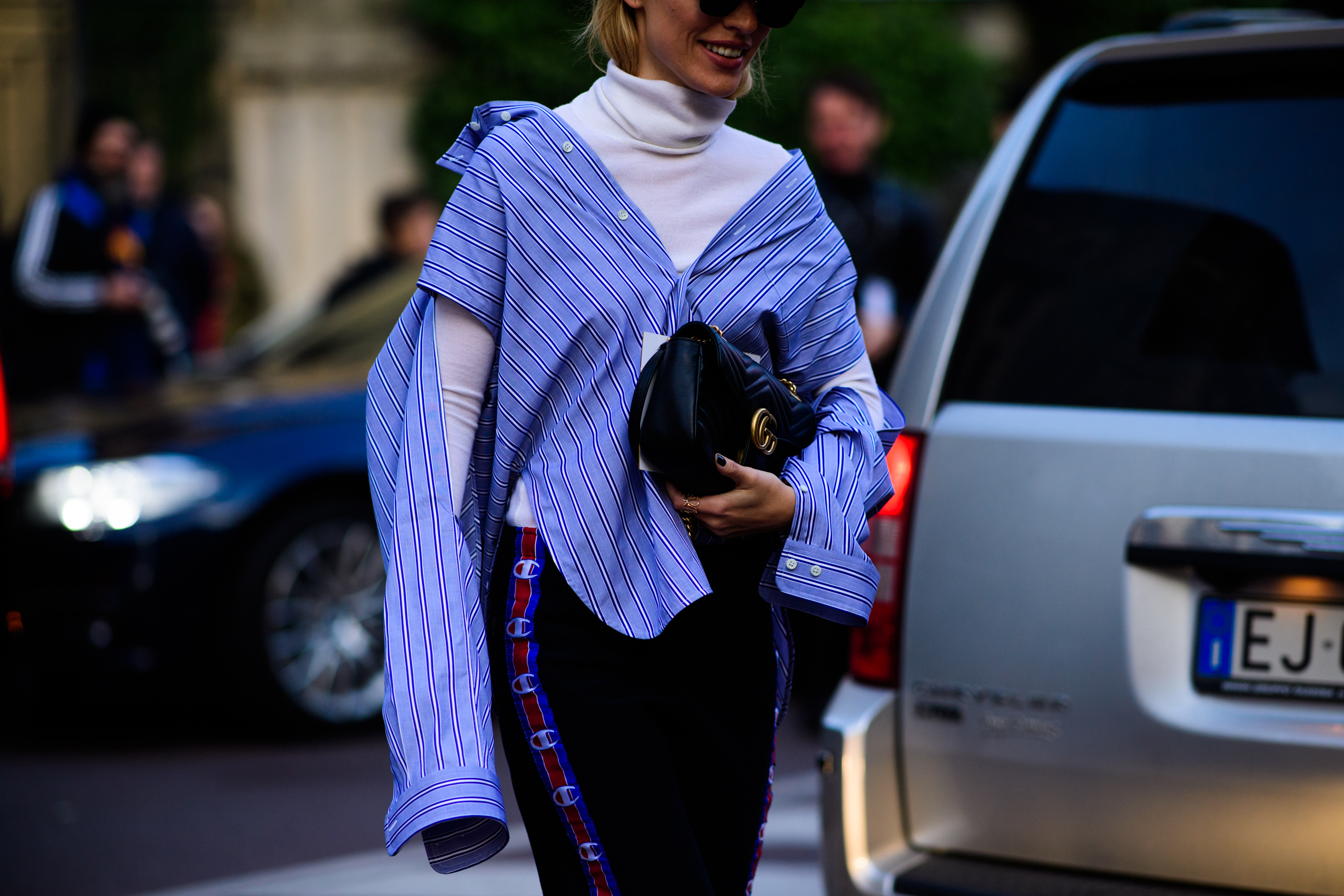 Woman wearing Vetements pants and Gucci bag
