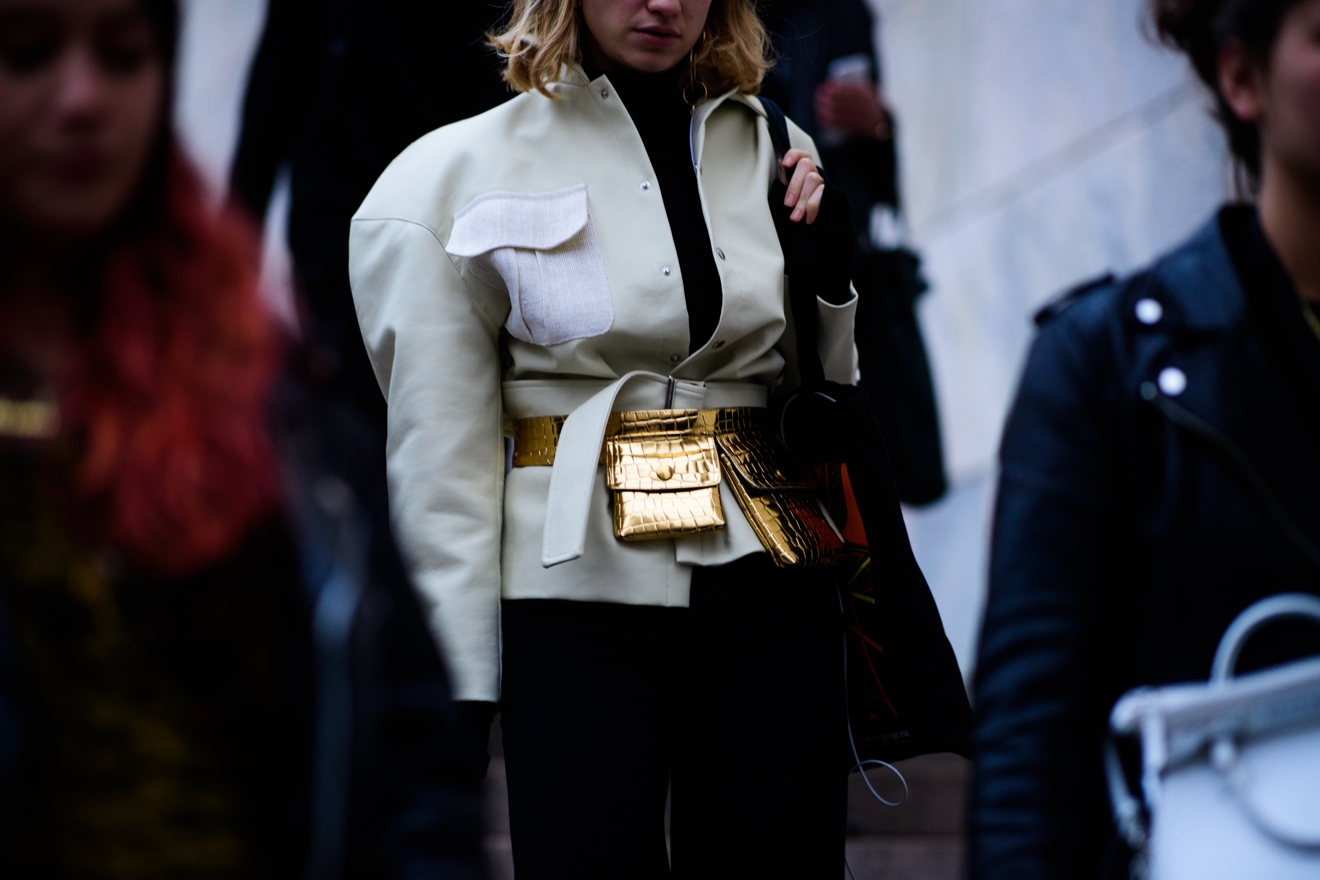 Woman waring golden bags