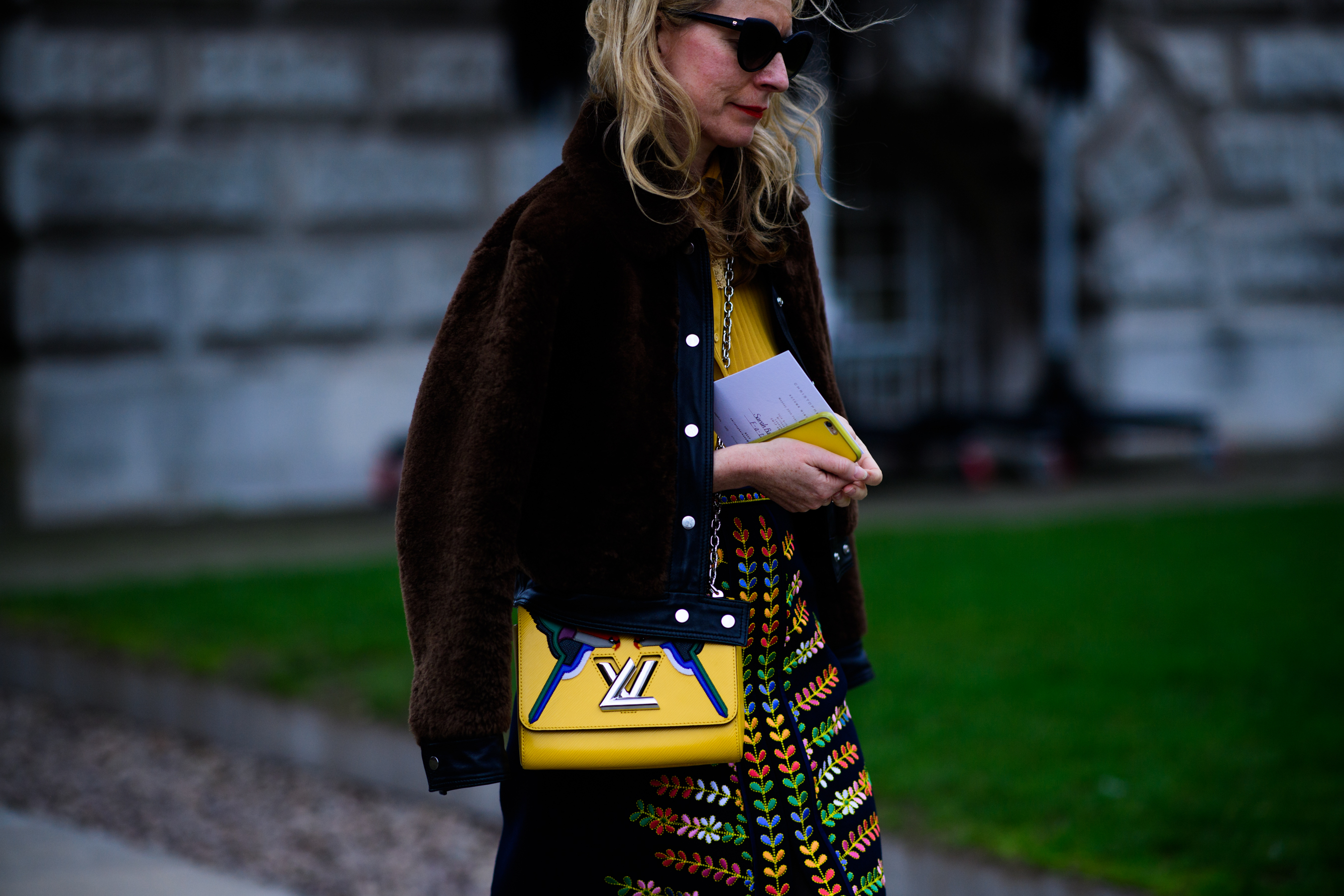 Woman with yellow Louis Vuitton bag