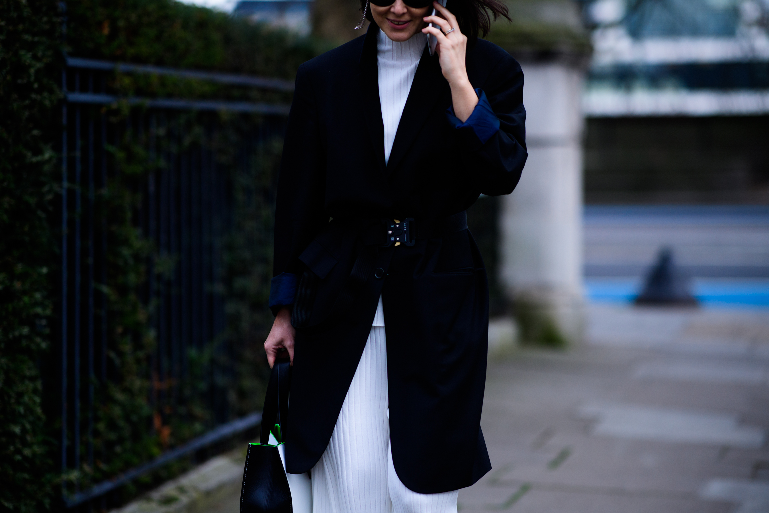 Woman wearing black belted coat